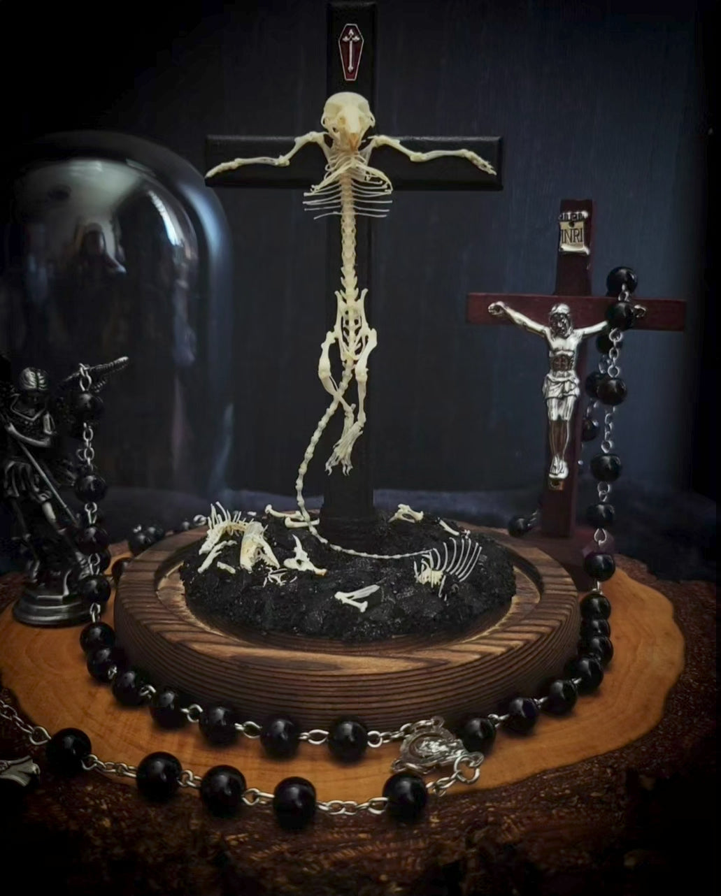 Crucifixa — handmade gothic glass dome display, made to order. Real mouse skeleton mounted on a cross under glass cloche on wooden base with occult elements, decorative bones and skeletal details. Dark ritual shrine decor.