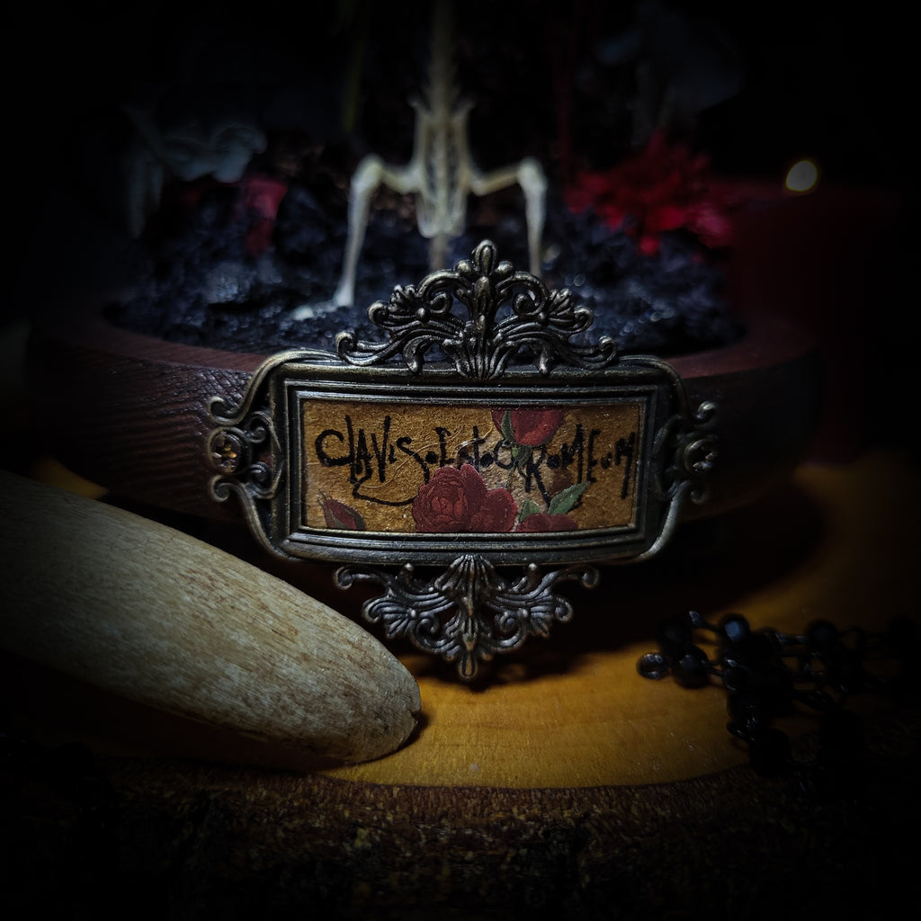 Key-keeper | Gothic — handmade gothic display with real mouse skeleton, ornamented key, miniature tombstone, preserved florals and Latin inscription plaque under glass dome on hand-painted wooden base, 17.5x11cm
