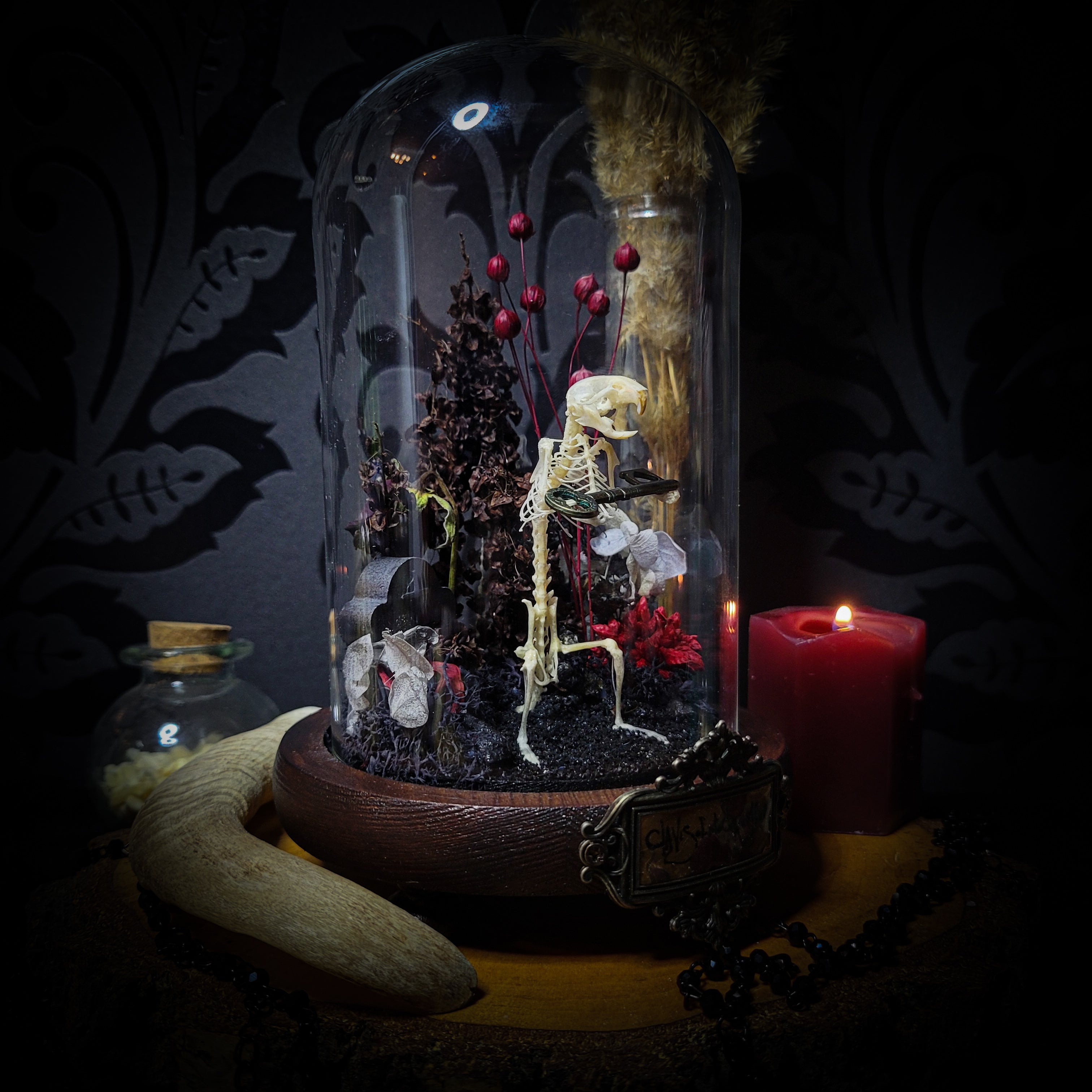 Key-keeper | Gothic — handmade gothic display with real mouse skeleton, ornamented key, miniature tombstone, preserved florals and Latin inscription plaque under glass dome on hand-painted wooden base, 17.5x11cm