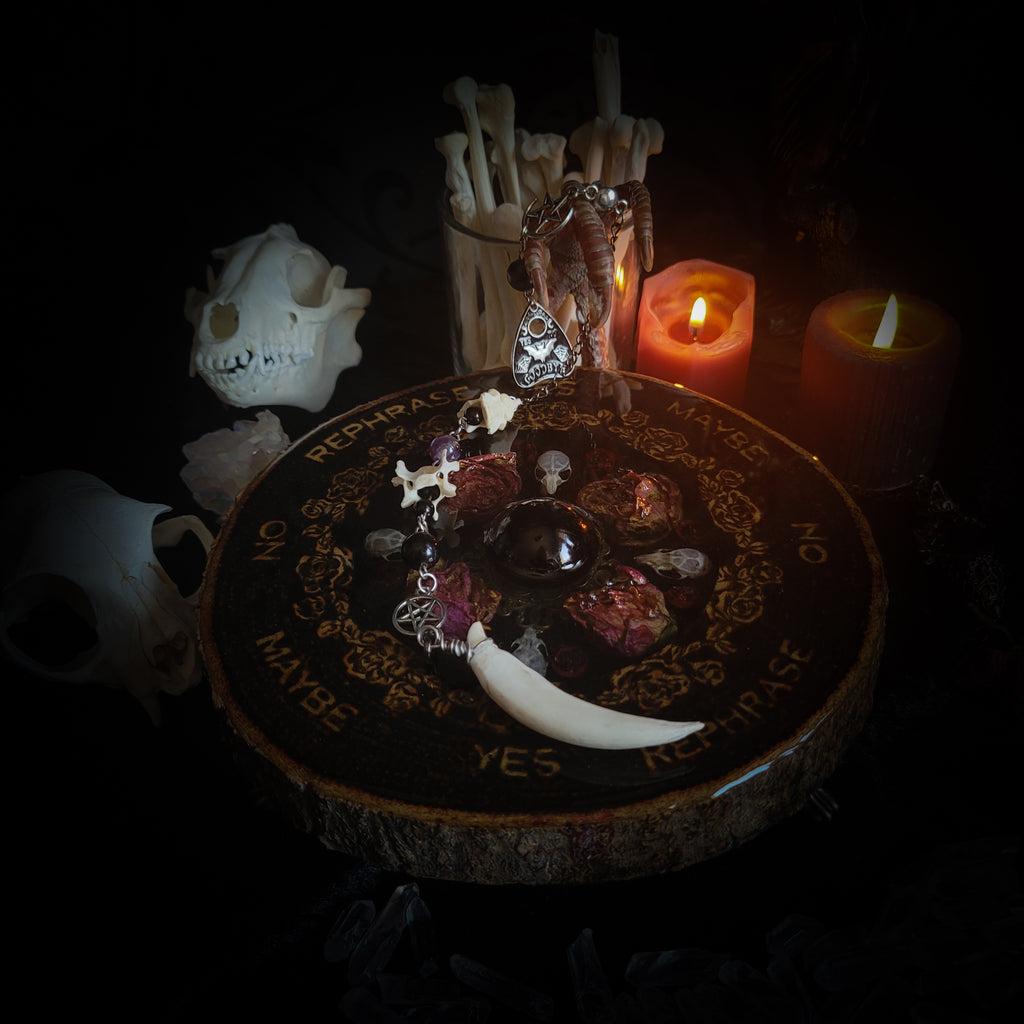 Wooden Pendulum Board — handmade divination pendulum board, made to order. Natural wood slice with hand-burned pyrography design, resin roses, crystals and ornamented legs. Custom witchcraft tool and altar decor by Morbid Oddities.