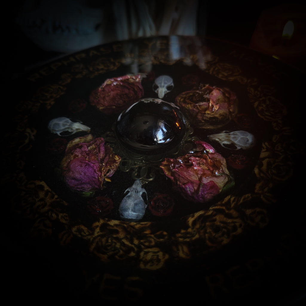 Wooden Pendulum Board — handmade divination pendulum board, made to order. Natural wood slice with hand-burned pyrography design, resin roses, crystals and ornamented legs. Custom witchcraft tool and altar decor by Morbid Oddities.