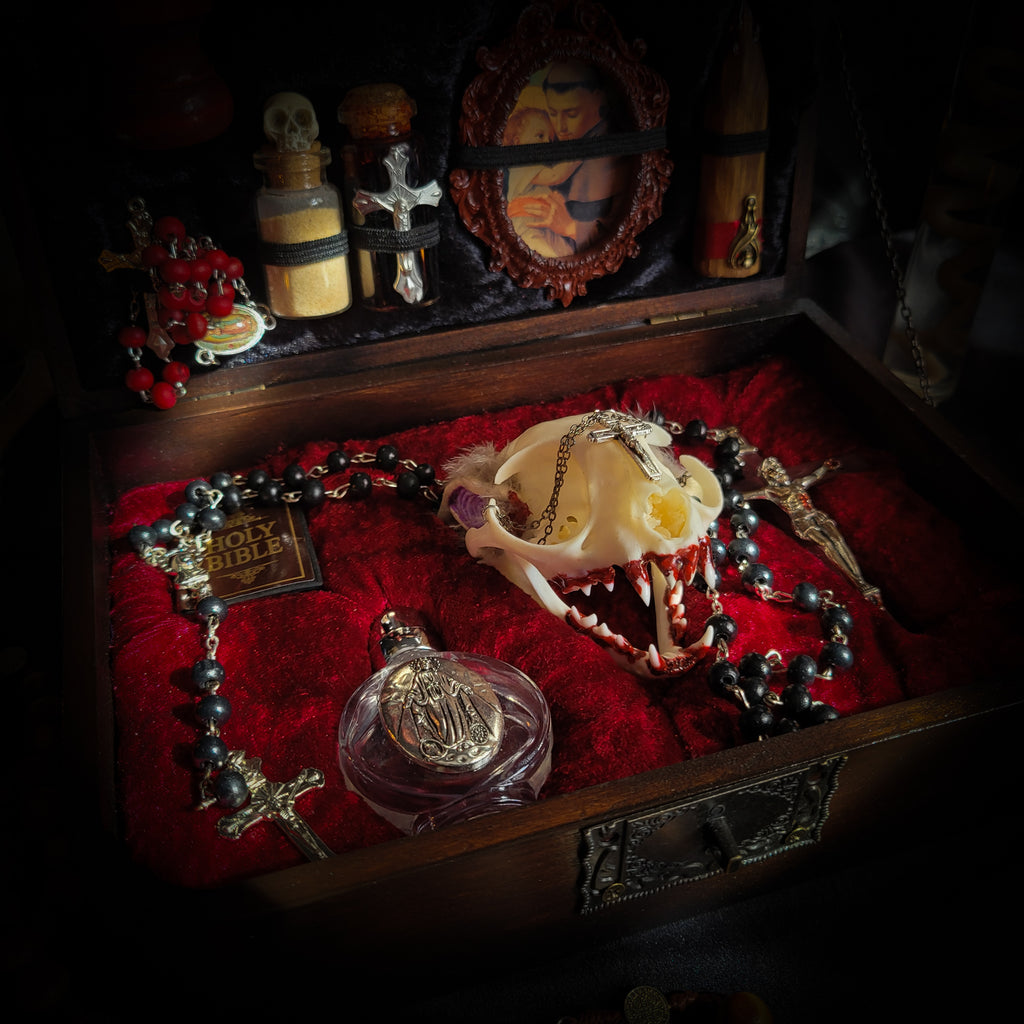 Vampire Hunter Kit — handmade gothic relic box, made to order. Hand-painted ornamented wooden suitcase with vampire stake, hammer, holy water, rosaries, crucifix, glass vials, miniature Bible and crimson velvet lining. Dark collectible decor, 23x17x9.5cm.