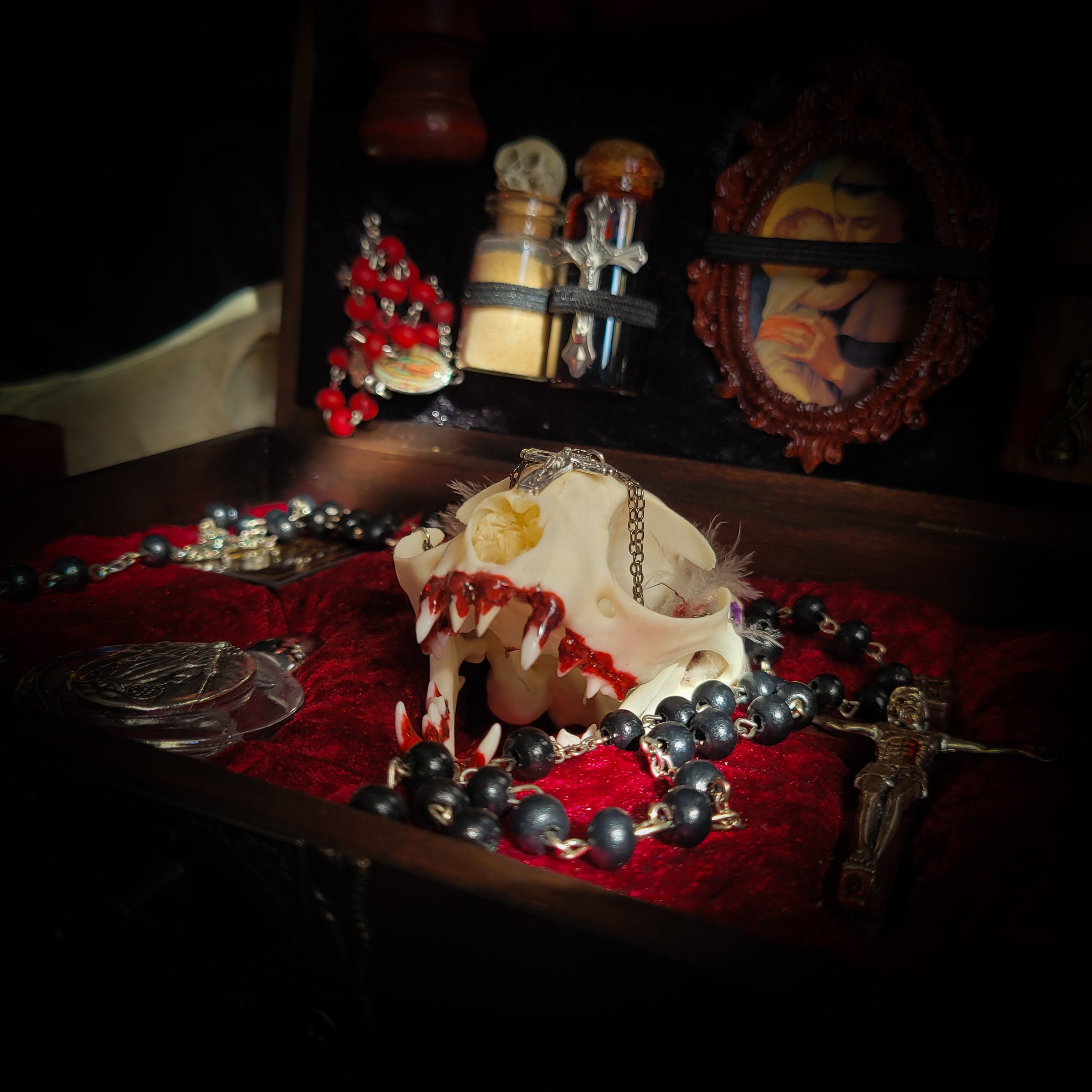 Vampire Hunter Kit — handmade gothic relic box, made to order. Hand-painted ornamented wooden suitcase with vampire stake, hammer, holy water, rosaries, crucifix, glass vials, miniature Bible and crimson velvet lining. Dark collectible decor, 23x17x9.5cm.