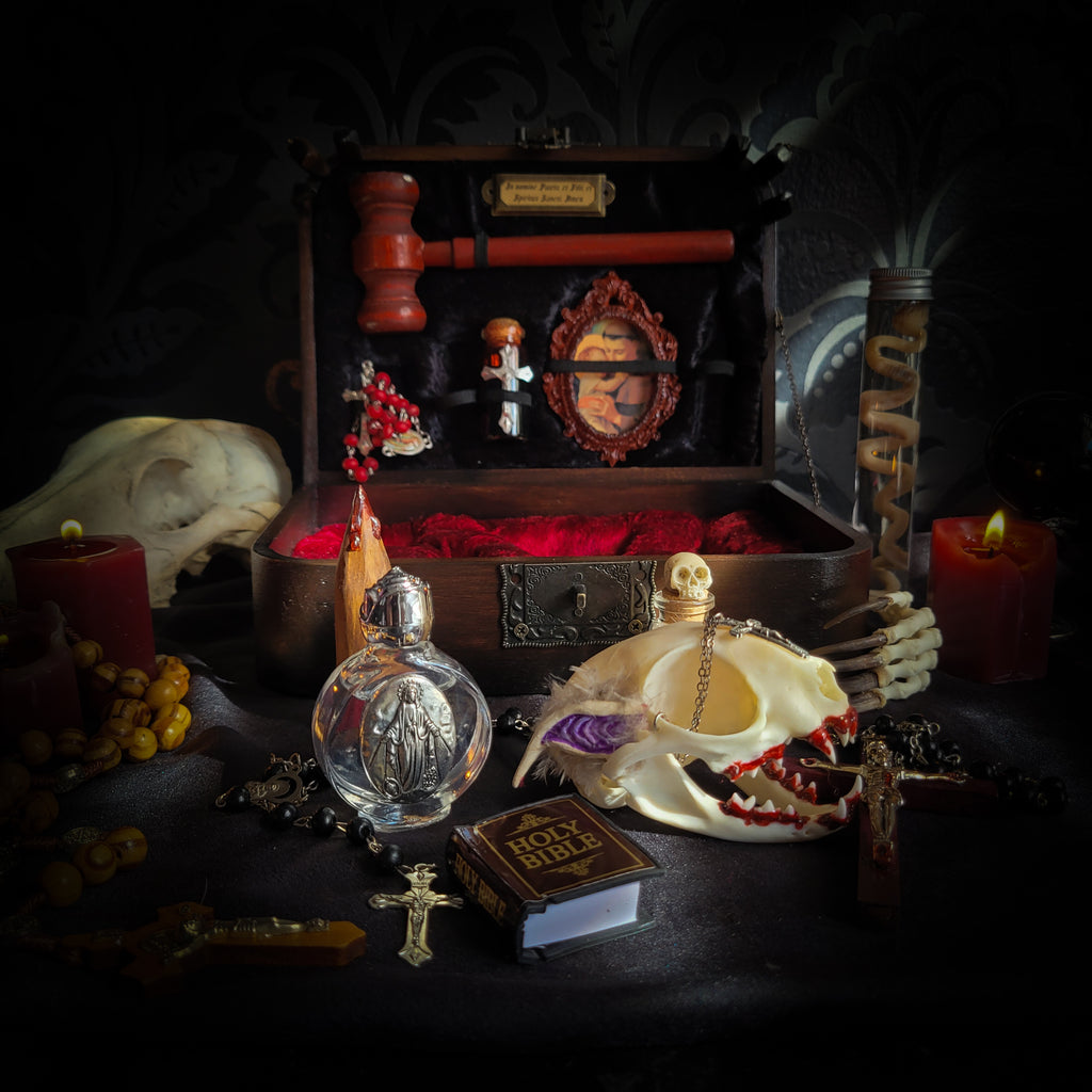 Vampire Hunter Kit — handmade gothic relic box, made to order. Hand-painted ornamented wooden suitcase with vampire stake, hammer, holy water, rosaries, crucifix, glass vials, miniature Bible and crimson velvet lining. Dark collectible decor, 23x17x9.5cm.