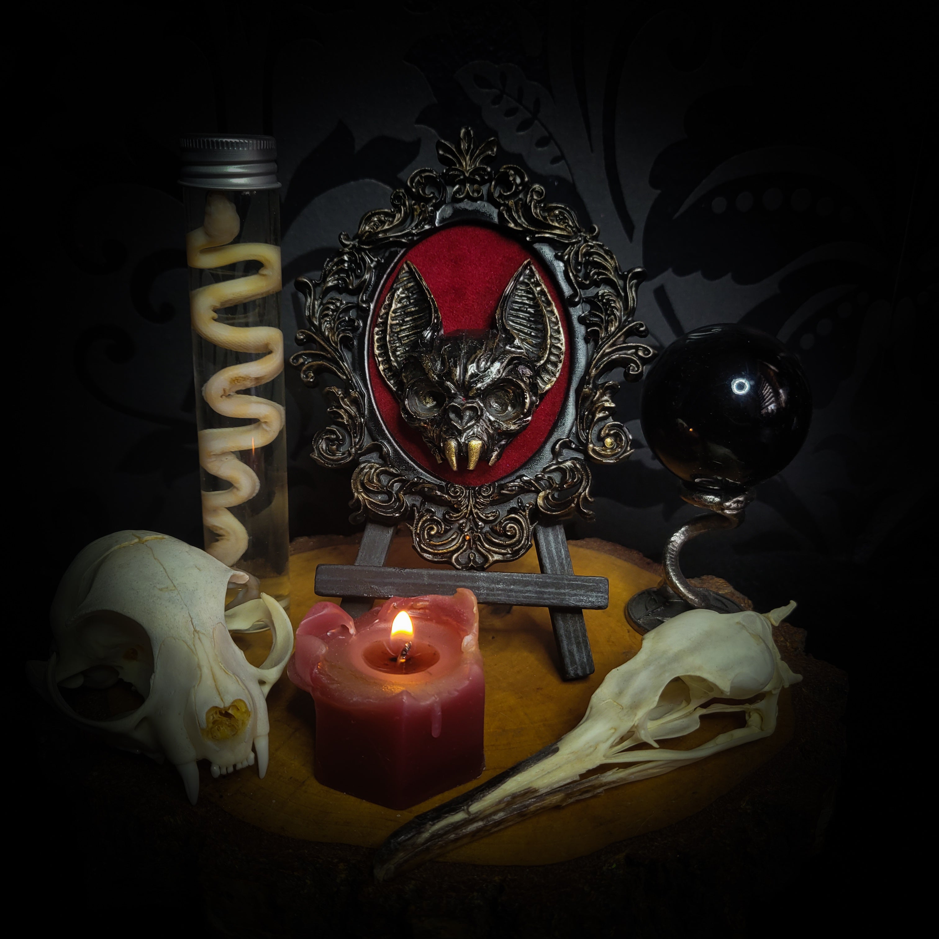 Handmade gothic wall frame featuring a detailed bat centerpiece set on deep blood-red velvet, enclosed in an ornate baroque-style frame. Dramatic, ritual-inspired made-to-order piece with rich crimson velvet and dark gothic aesthetic, 12.5x10cm | Morbid Oddities