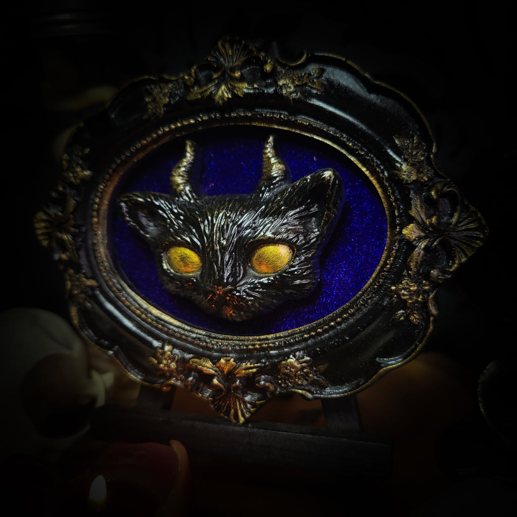 Felis Daemonium — handmade gothic shadowbox, made to order. Stylized cat head with horns, hand-cast and hand-painted, set on velvet background in ornate baroque frame. Occult wall decor, 12x10cm.