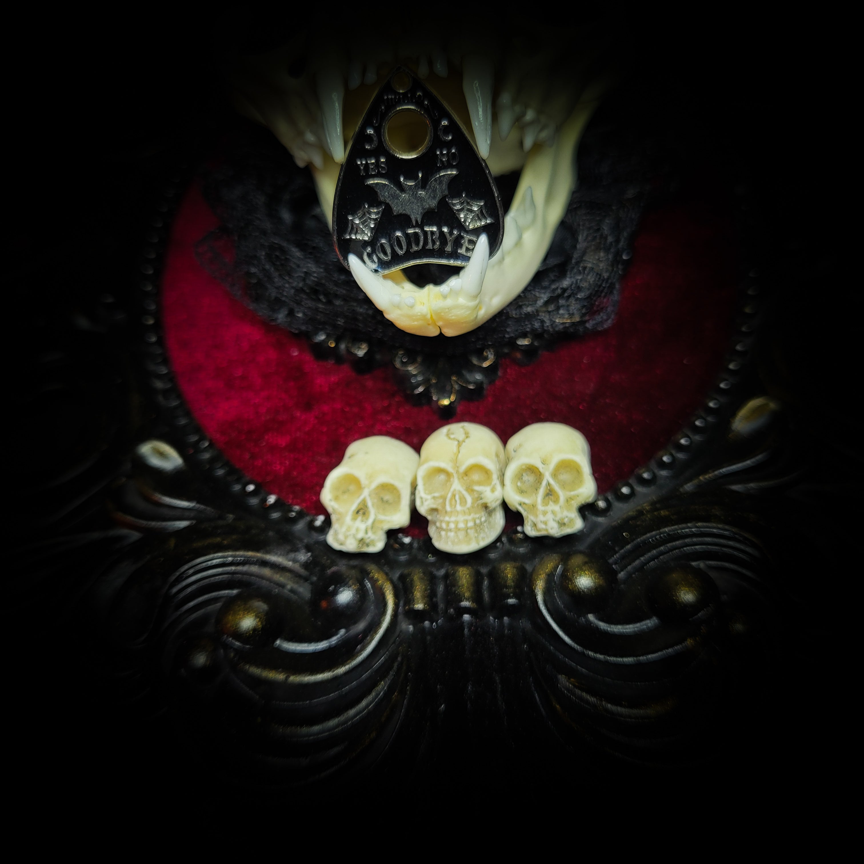 Gothic Kitten | Gothic — handmade gothic wall decor with real cat skull, Ouija planchette and baroque ornamental frame on deep red velvet, dark occult aesthetic, 24x20.5cm