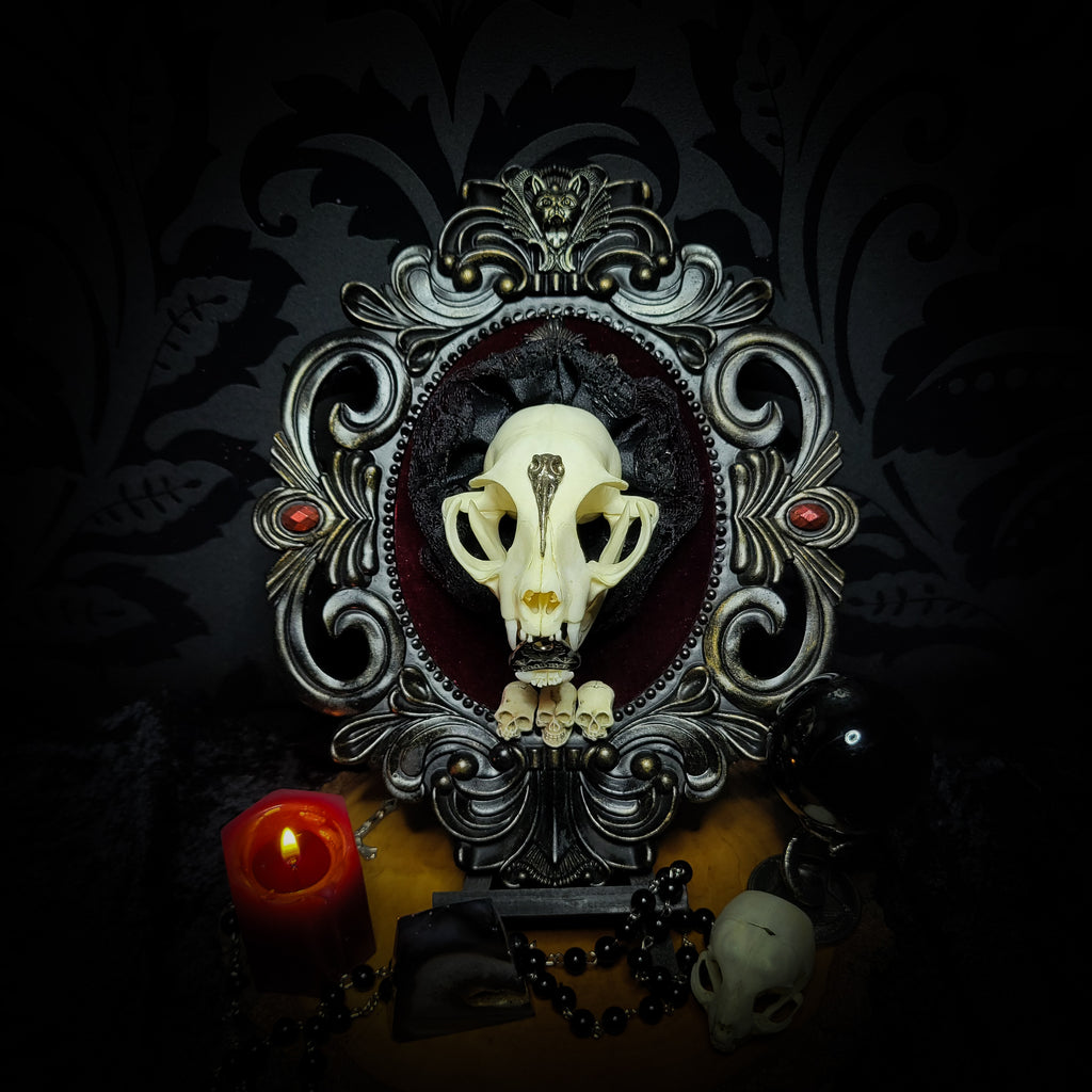Gothic Kitten | Gothic — handmade gothic wall decor with real cat skull, Ouija planchette and baroque ornamental frame on deep red velvet, dark occult aesthetic, 24x20.5cm