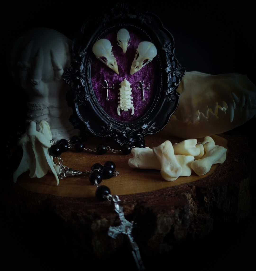 Velora | Small Relics — handmade gothic wall decor with two real bird skulls, mouse skull and rat spine section in hand-painted frame on deep purple velvet, dark macabre aesthetic, 12x10cm