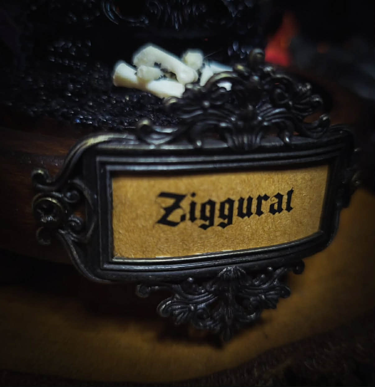 Siggurat | Occult — handmade gothic altar piece with ziggurat-inspired centerpiece, real bone elements, sea urchin skeleton, decorative crystals and chains under glass dome on hand-painted wooden base, 10x10cm