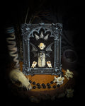 Vesper Vessel gothic black and silver frame with a bat skull, snake skin vial, vampire-style wings and roe deer teeth on black velvet.