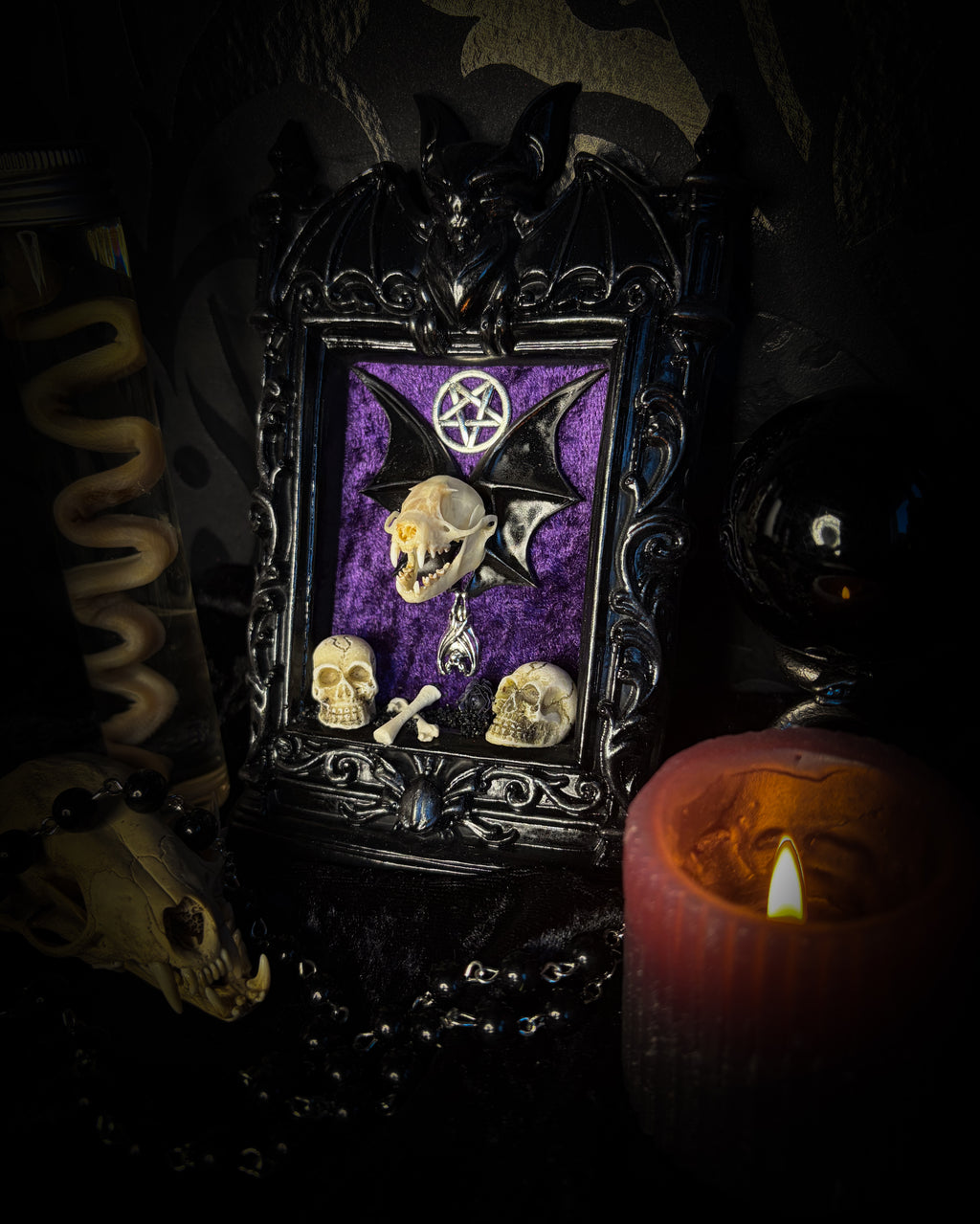 Violet Hex — handmade gothic wall relic, ready to ship. Real bat skull with hand-cast wings on violet crushed velvet in black and gold frame with sculpted bat, ornamental skulls, wax rose and pentagram details. One-of-a-kind dark decor, 16x11cm.