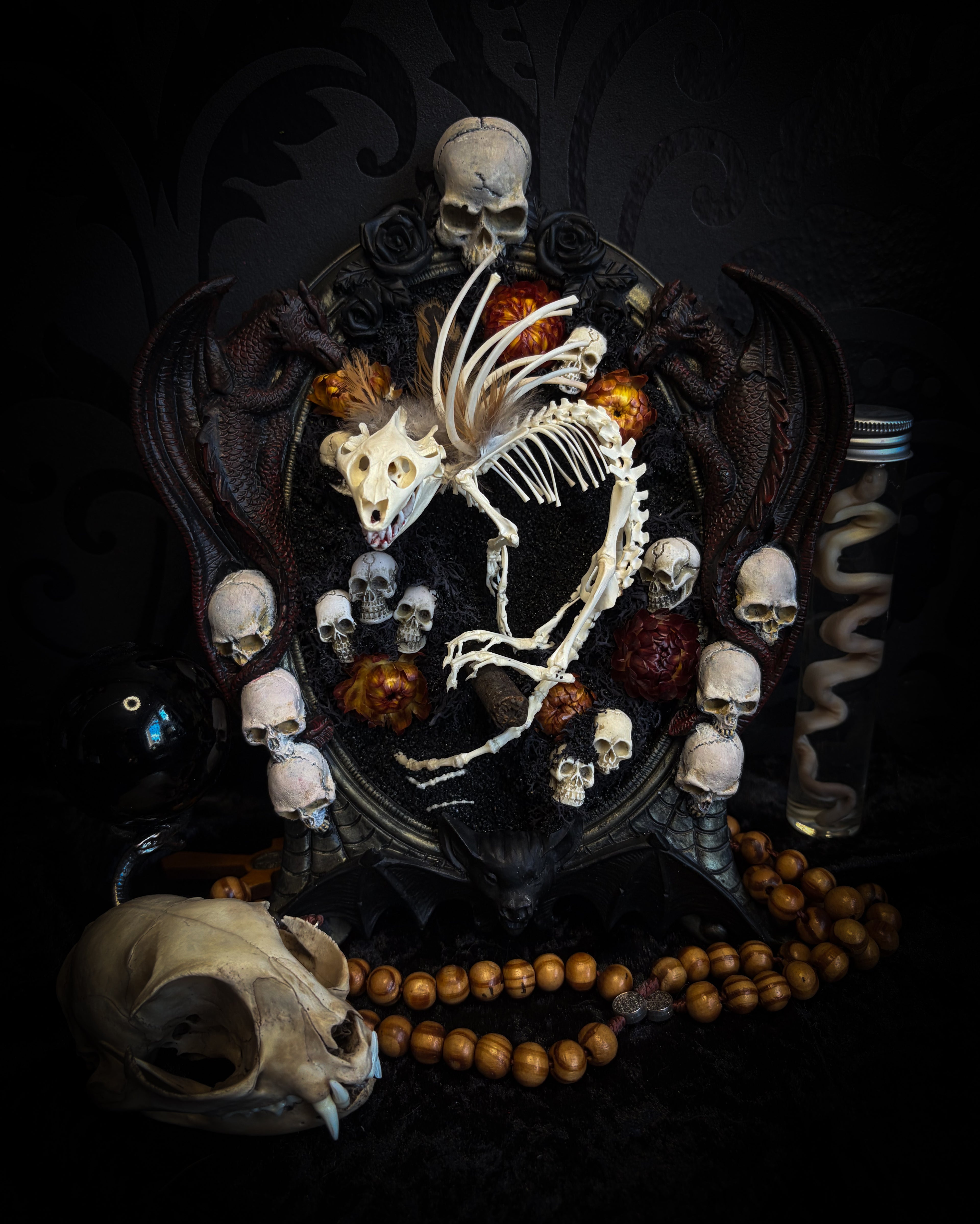 Handmade gothic wall decor — hand-assembled real bone dragon skeleton with turtle skull, hand-cast gothic frame with dragons and skull motifs, 25x20cm