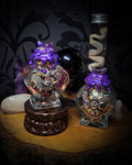 Handmade gothic twin spell jar set — two heart-shaped glass vessels sealed with violet wax and amethyst moon, filled with herbs, crystals and bones for love binding ritual