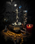 Crucifixa — handmade gothic glass dome display, made to order. Real mouse skeleton mounted on a cross under glass cloche on wooden base with occult elements, decorative bones and skeletal details. Dark ritual shrine decor.