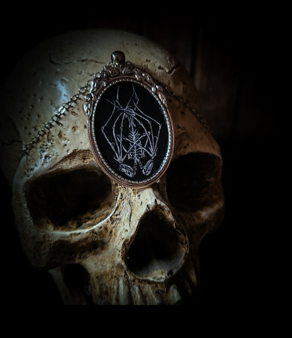 Handmade gothic necklace — hand-painted bat sigil, oval pendant with metal frame and chain, varnish finish