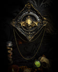 The Night Sovereign | handmade gothic relic with hand-cast painted bat skull, gold wings, gold chain and black velvet on ornate black frame | Morbid Oddities
