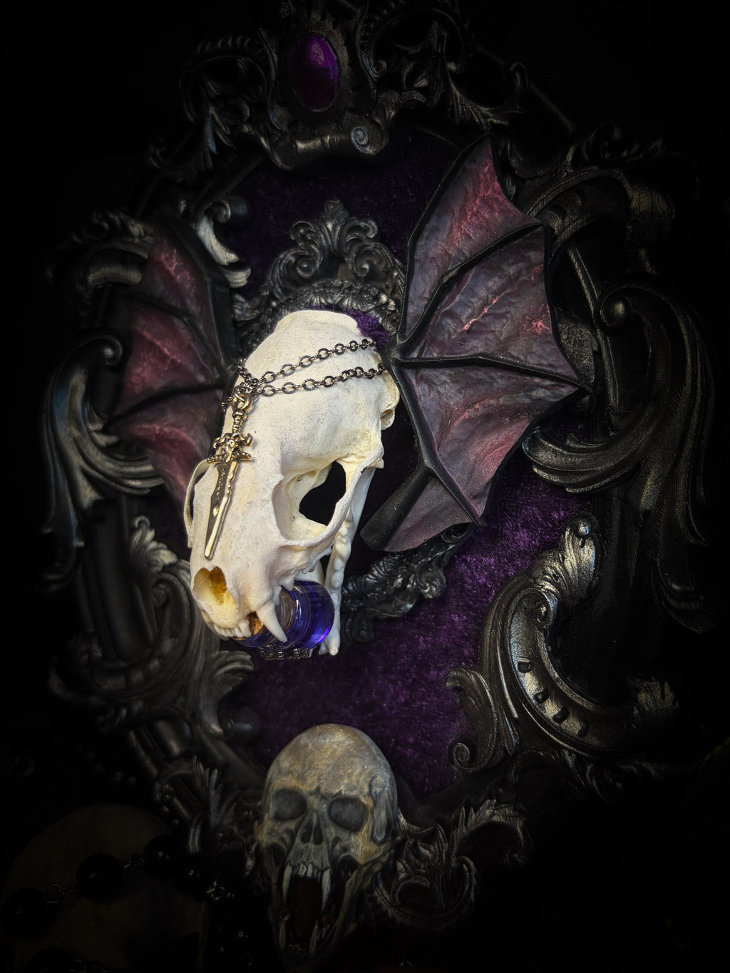 Handmade gothic wall decor with real mink skull, hand-cast bat wings, purple velvet and silver frame — Sepharius by Morbid Oddities