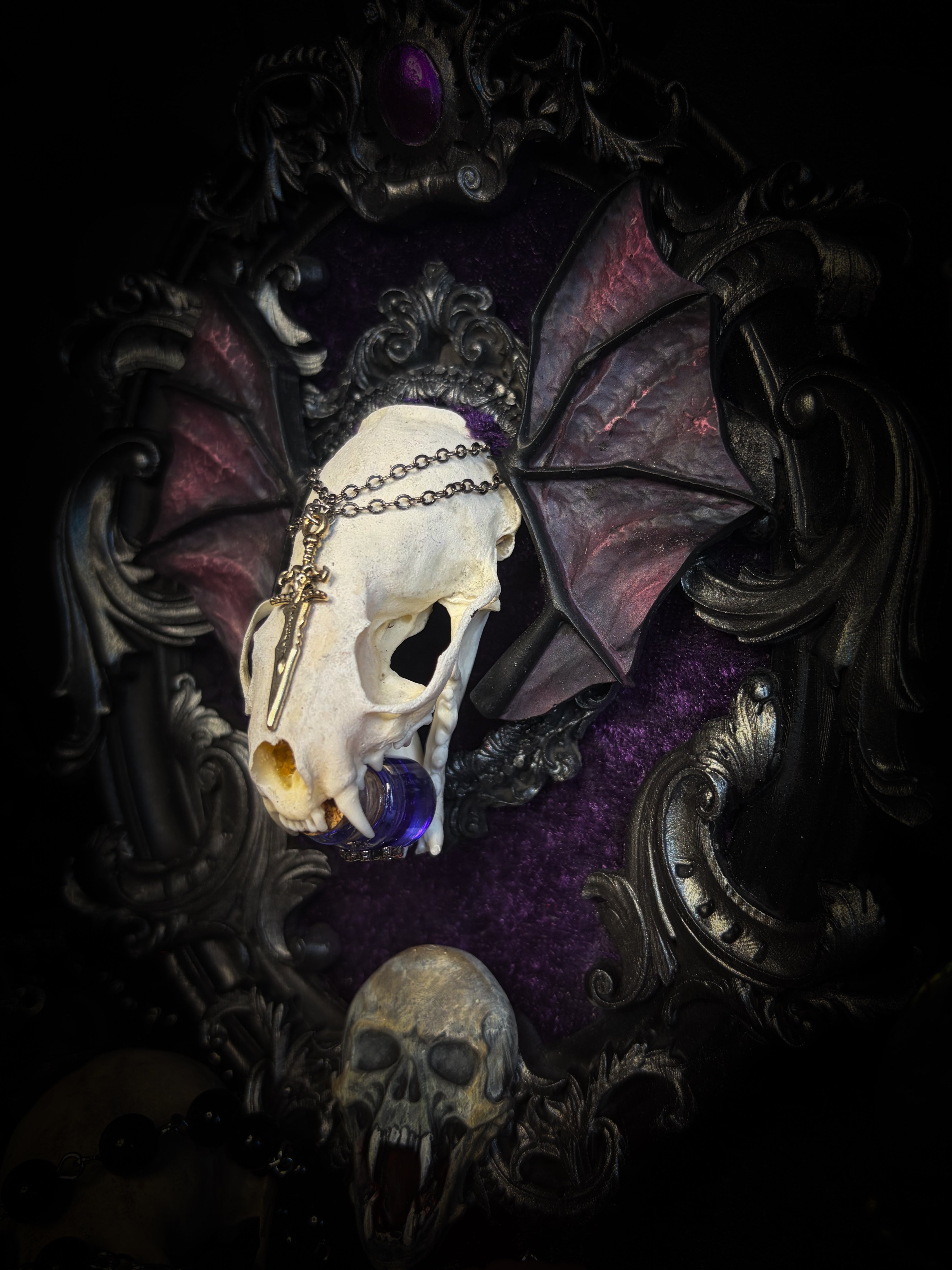 Handmade gothic wall decor with real mink skull, hand-cast bat wings, purple velvet and silver frame — Sepharius by Morbid Oddities