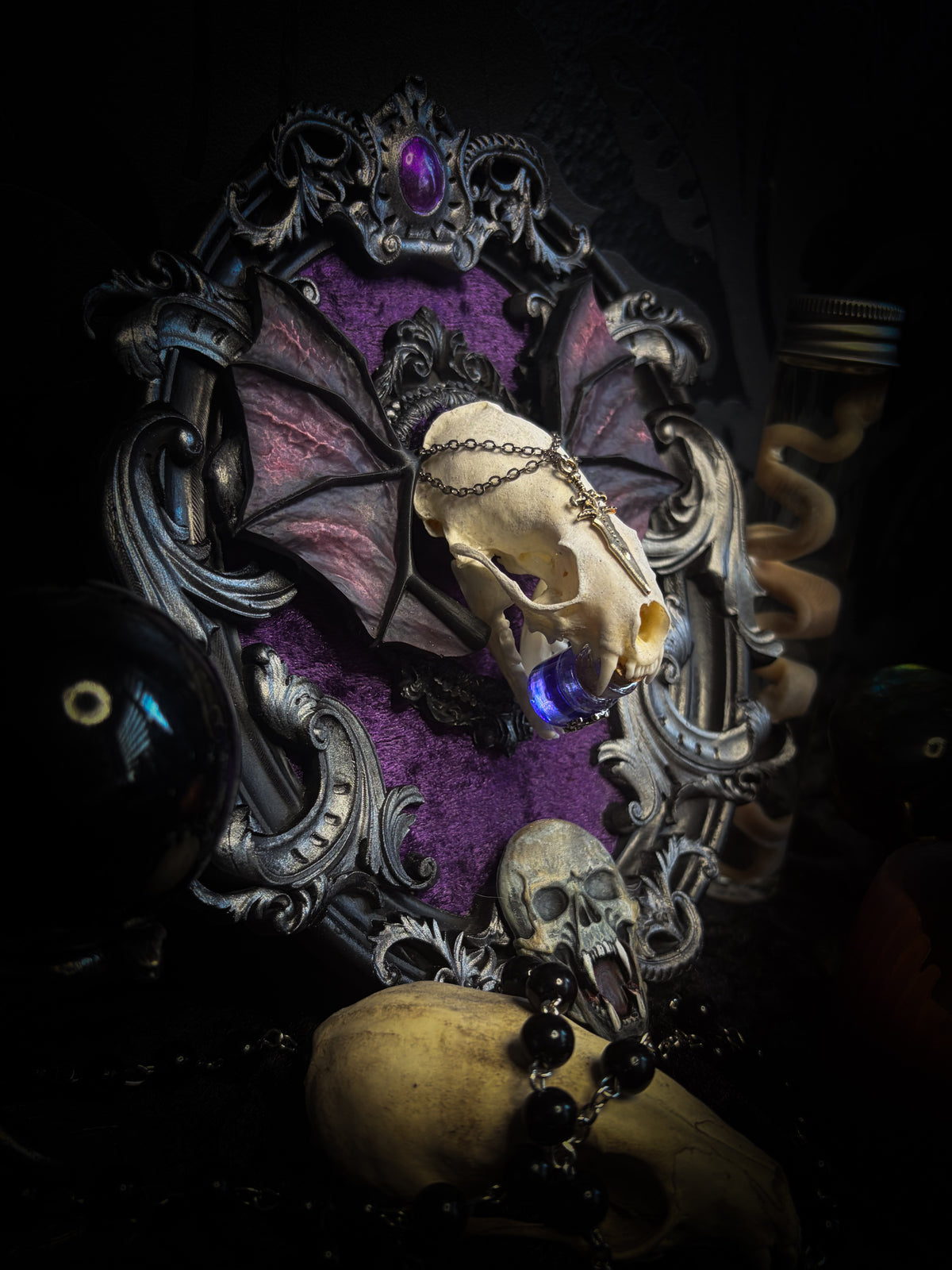 Handmade gothic wall decor with real mink skull, hand-cast bat wings, purple velvet and silver frame — Sepharius by Morbid Oddities