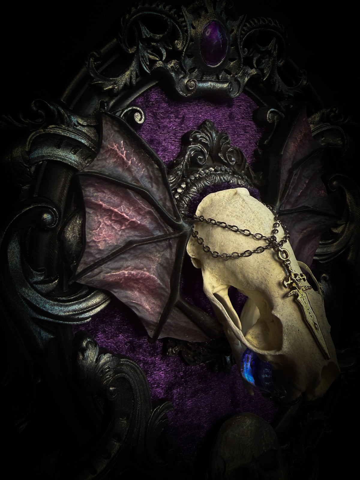 Handmade gothic wall decor with real mink skull, hand-cast bat wings, purple velvet and silver frame — Sepharius by Morbid Oddities