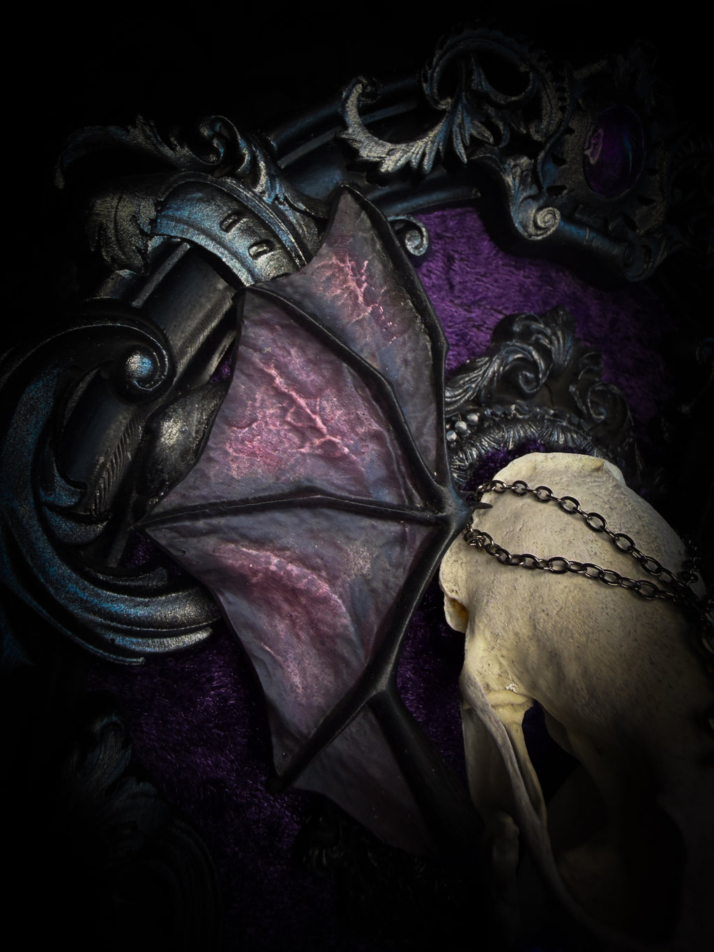 Handmade gothic wall decor with real mink skull, hand-cast bat wings, purple velvet and silver frame — Sepharius by Morbid Oddities
