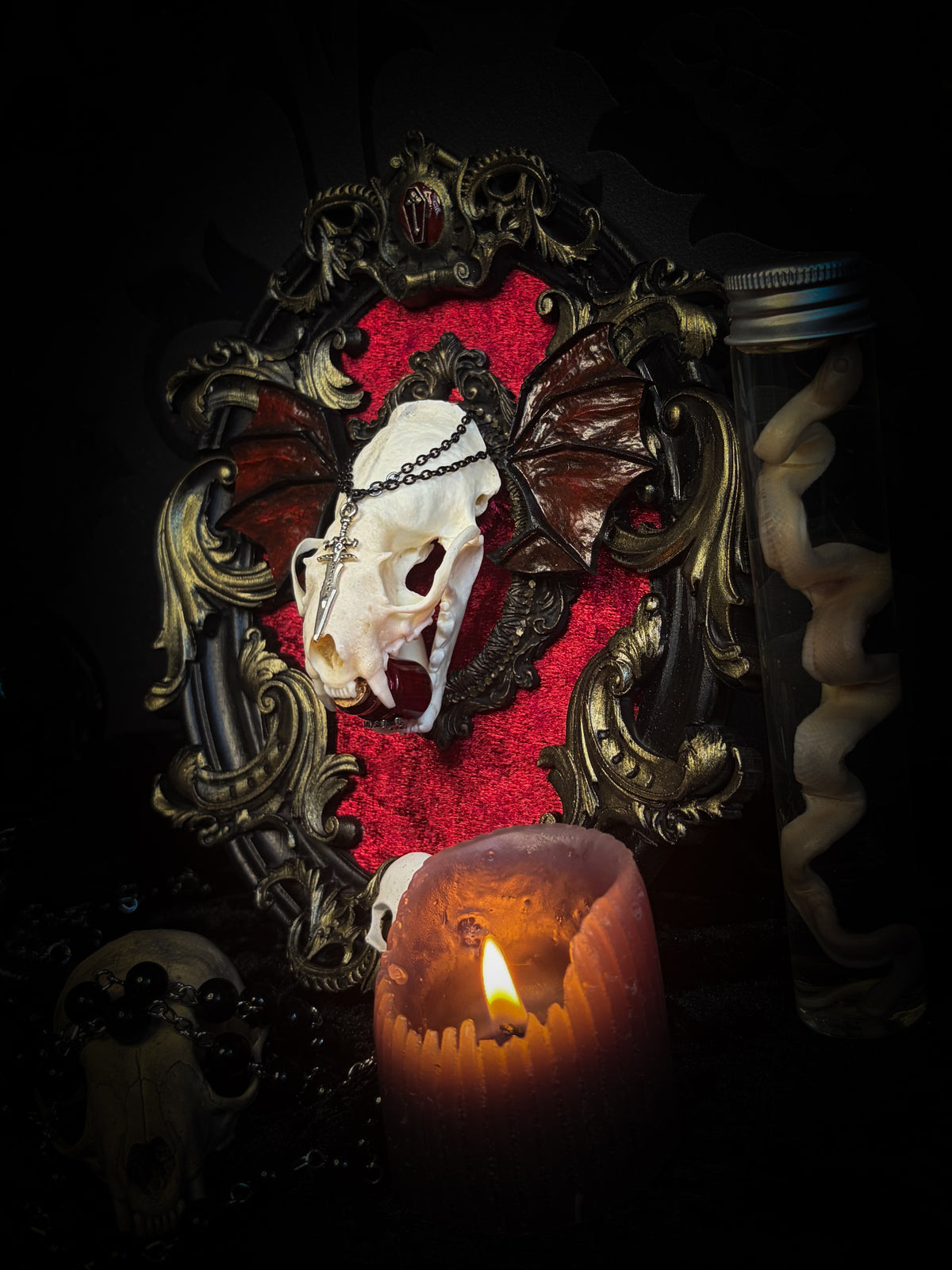 Handmade gothic wall decor with real mink skull, hand-cast bat wings, red velvet and gold frame — Malachar by Morbid Oddities