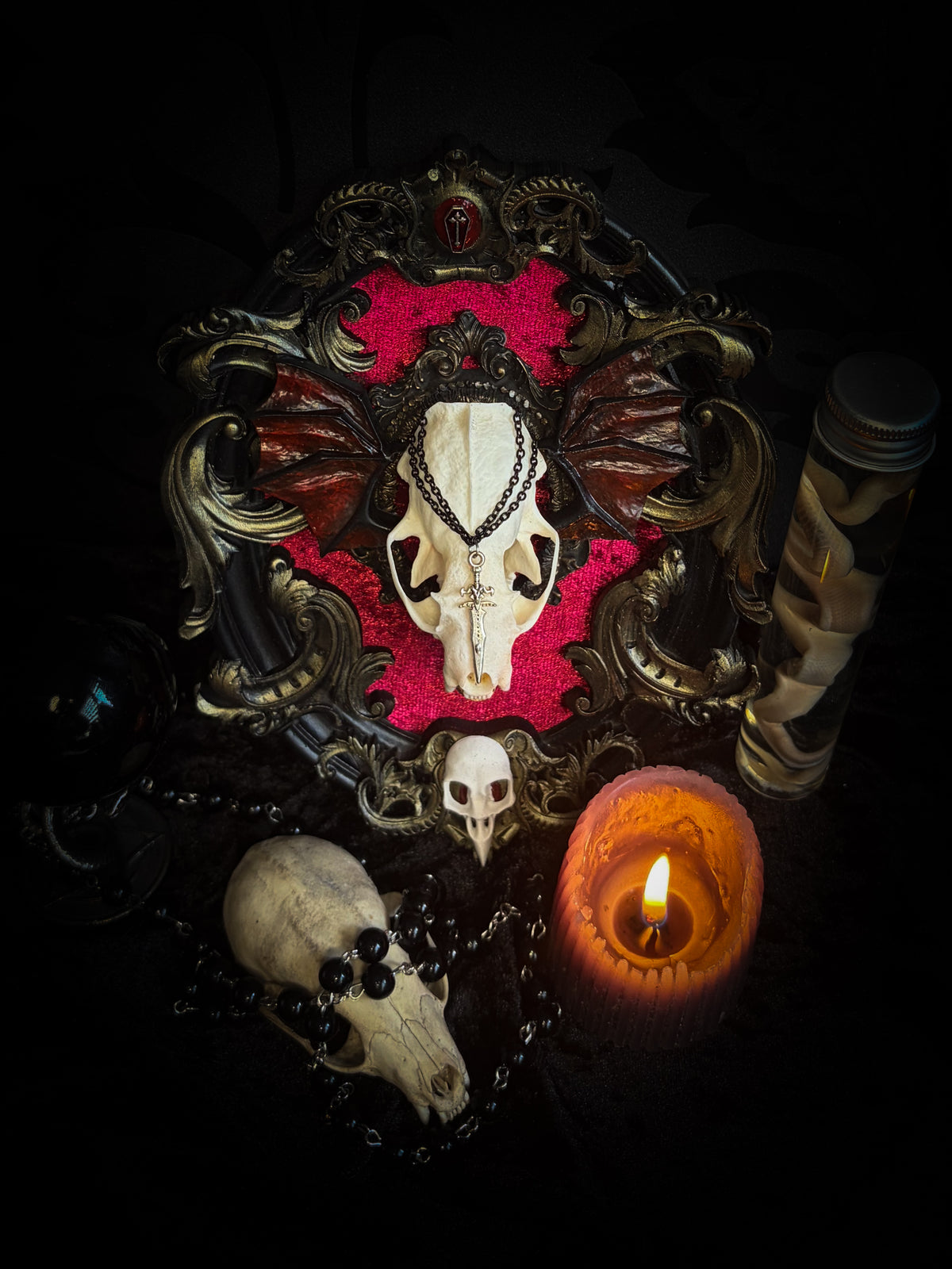 Handmade gothic wall decor with real mink skull, hand-cast bat wings, red velvet and gold frame — Malachar by Morbid Oddities