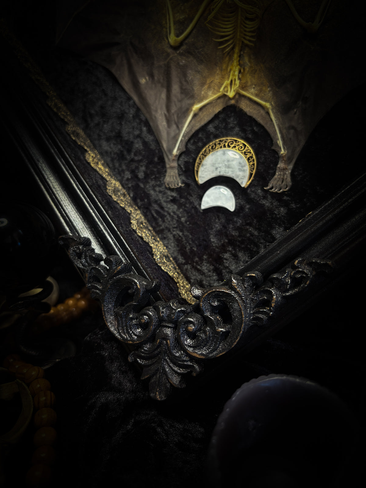 Moonlit Bat | Shadowbox — massive handmade black wooden shadowbox with a half-mummified, half-skeletal bat, three quartz moons, black velvet and gold lace.