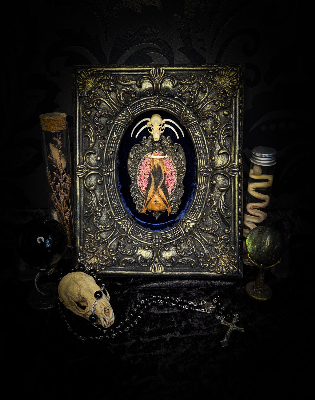 Floral Delight | Bats — handmade gothic wall decor with real preserved bat, bat skull, bone ribs, deep pink preserved flowers on navy velvet in aged hand-cast ornamental frame with glass, 25x19cm