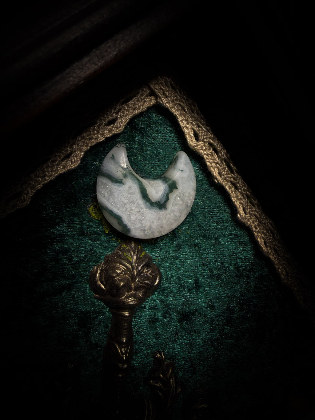 The Moonlit Gardener: Actias selene moth with an ornate sword, moss agate moon and dried flowers on green velvet in a handmade pointed wooden shadowbox.