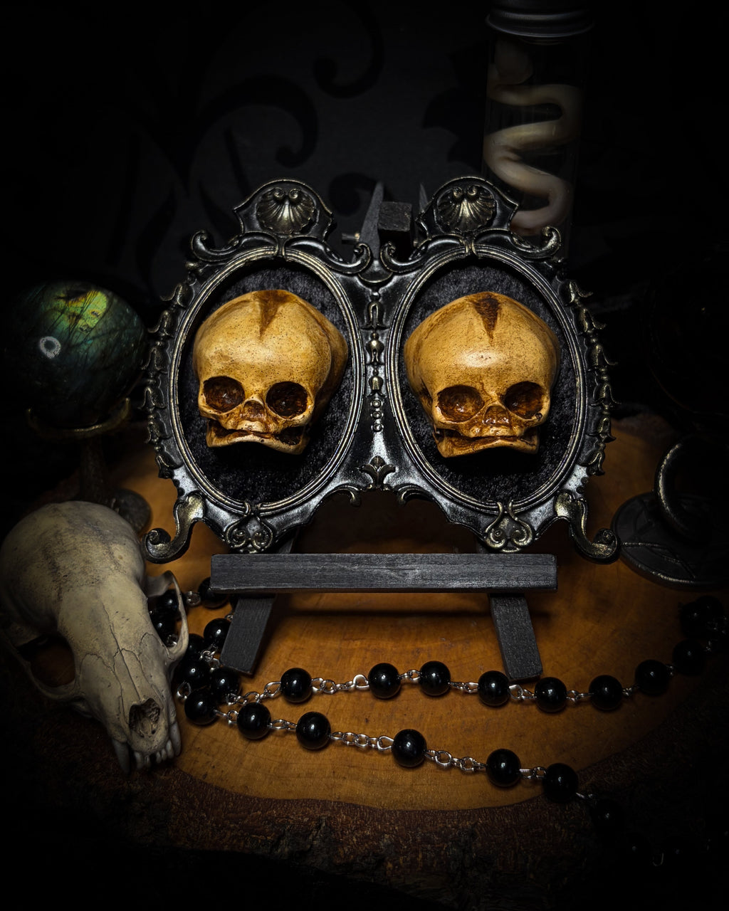 Kindred Remains by Morbid Oddities, a handmade gothic double frame with cast skulls on velvet, available with newborn skulls, adult skulls or a mixed pair