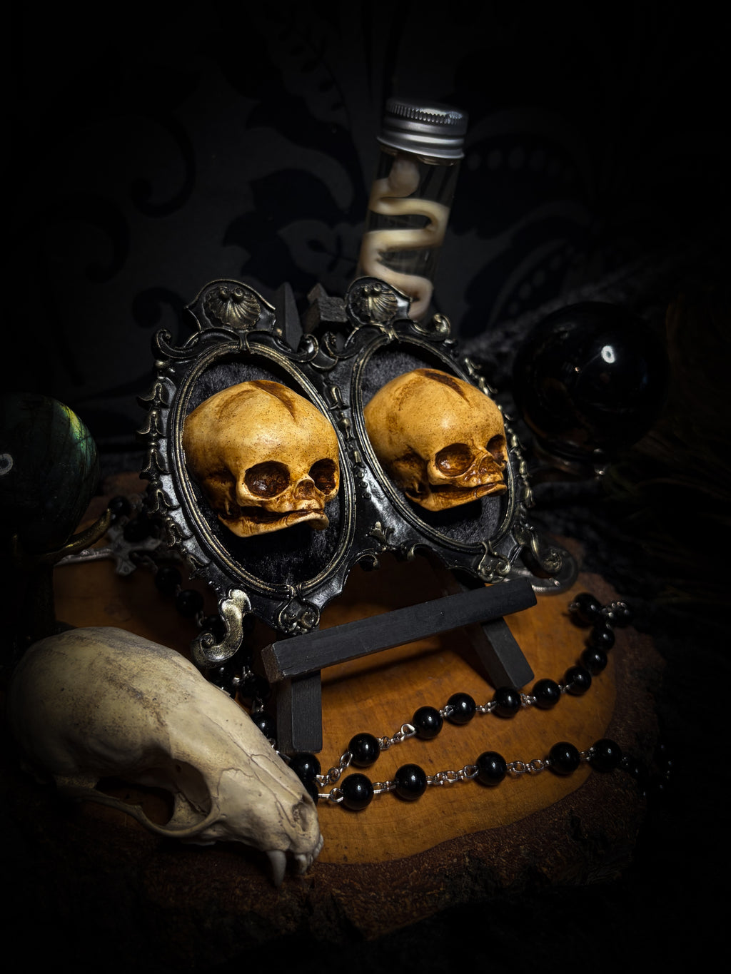 Kindred Remains by Morbid Oddities, a handmade gothic double frame with cast skulls on velvet, available with newborn skulls, adult skulls or a mixed pair