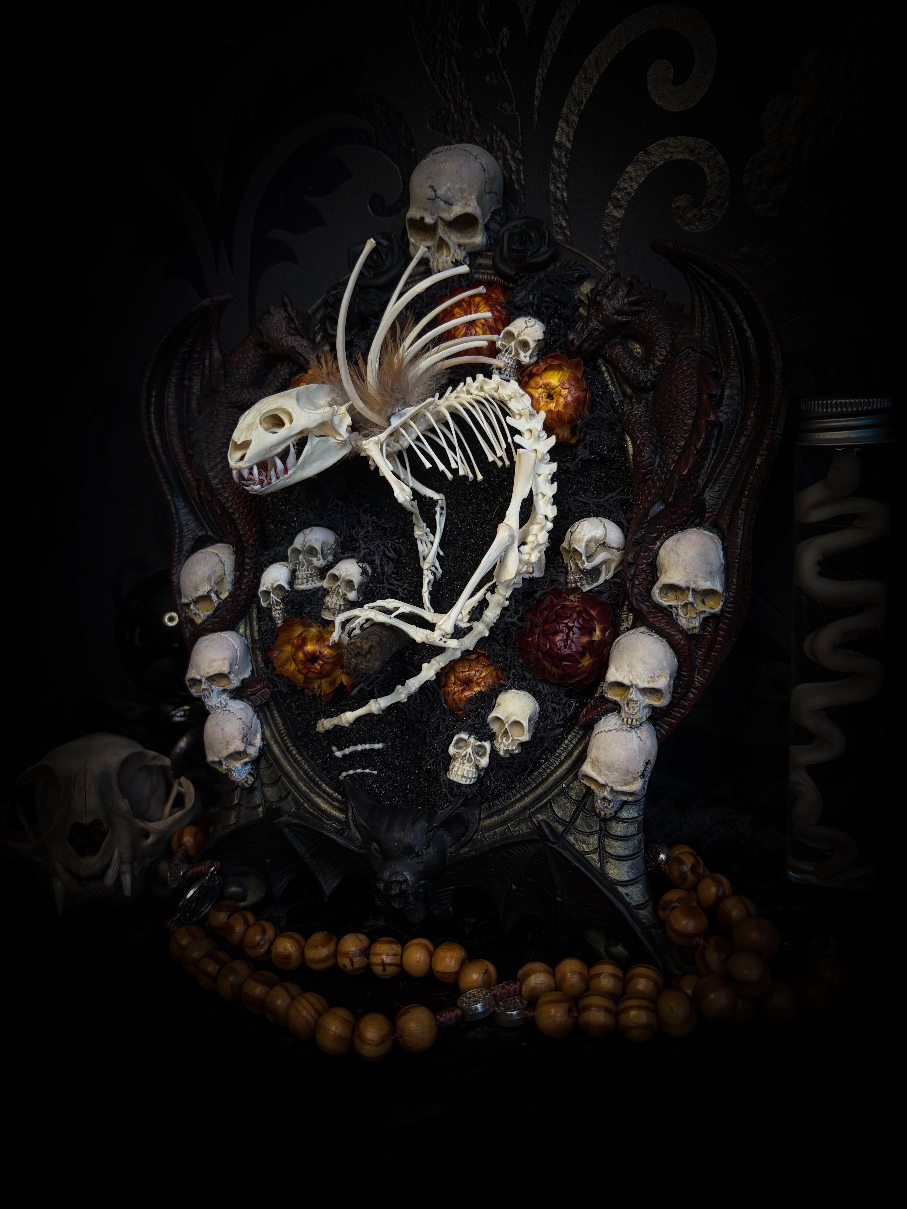 Handmade gothic wall decor — hand-assembled real bone dragon skeleton with turtle skull, hand-cast gothic frame with dragons and skull motifs, 25x20cm
