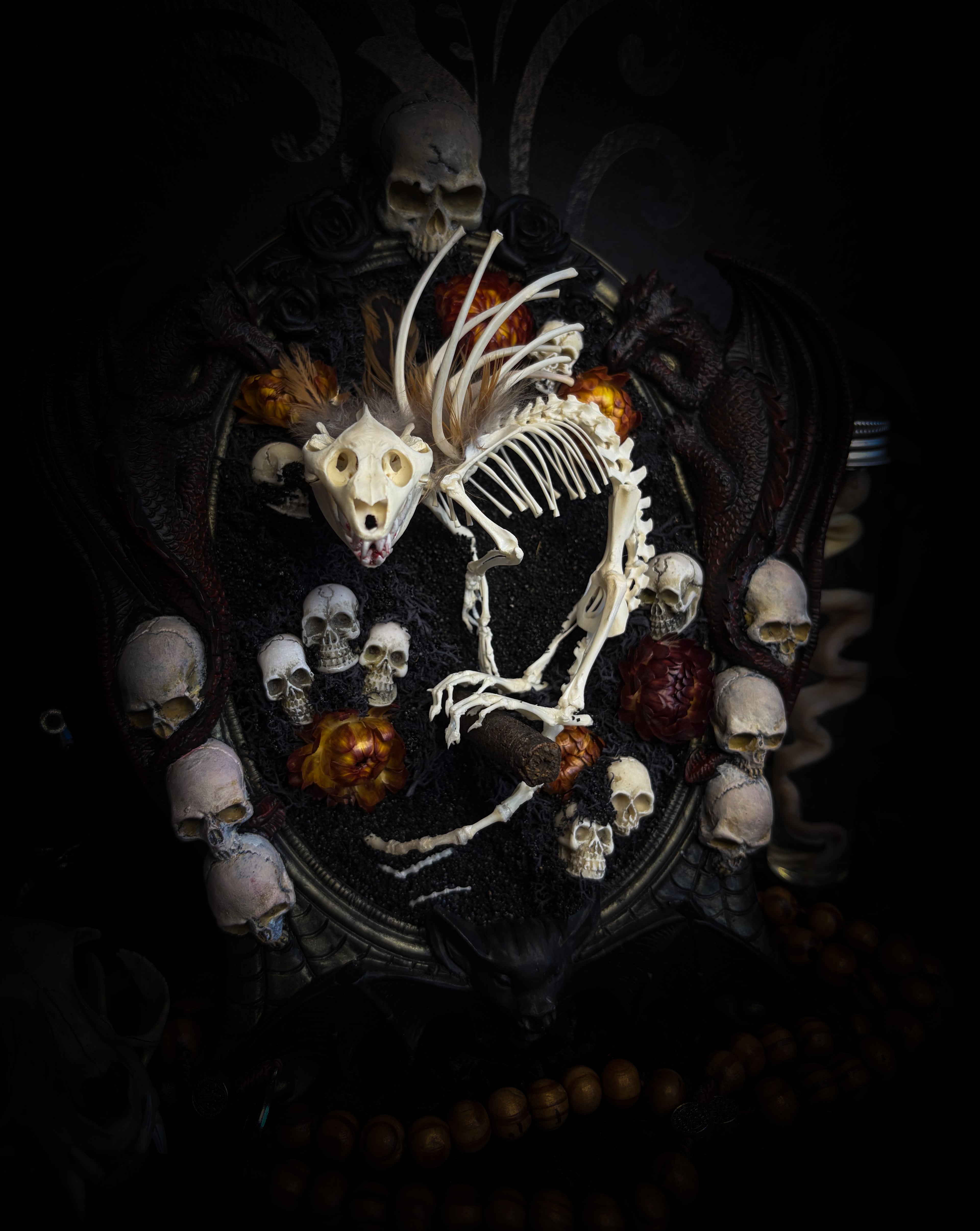 Handmade gothic wall decor — hand-assembled real bone dragon skeleton with turtle skull, hand-cast gothic frame with dragons and skull motifs, 25x20cm