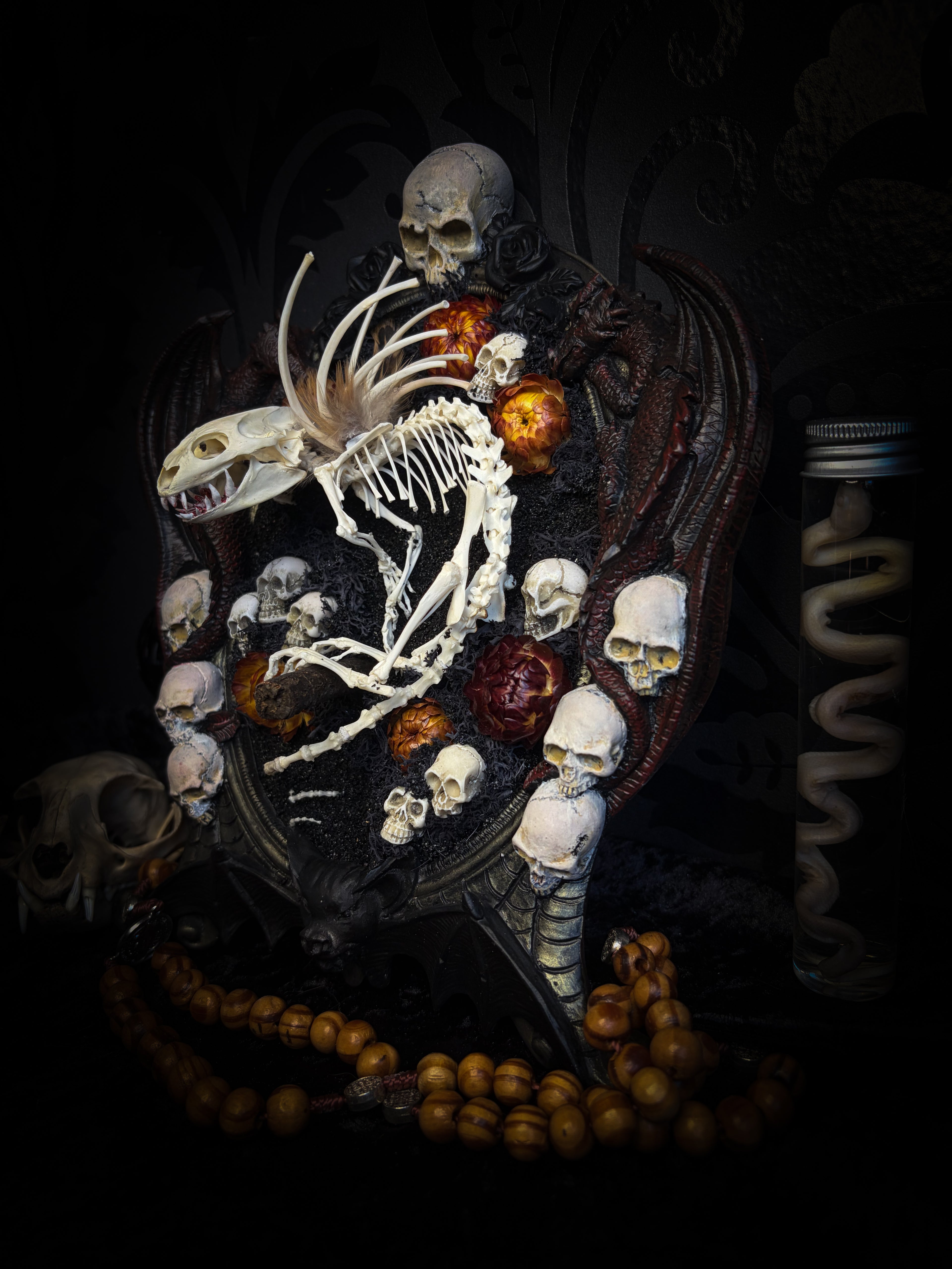 Handmade gothic wall decor — hand-assembled real bone dragon skeleton with turtle skull, hand-cast gothic frame with dragons and skull motifs, 25x20cm