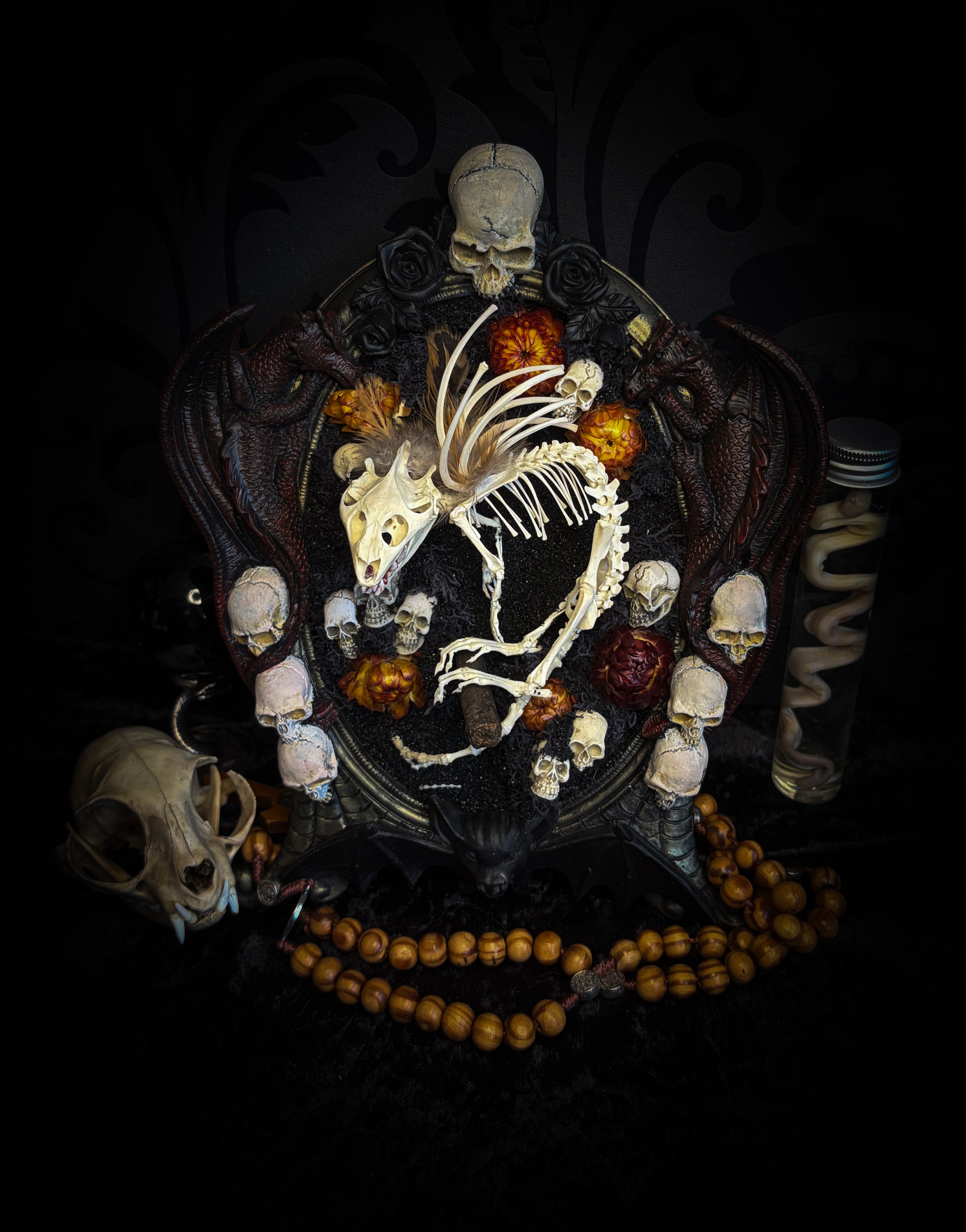 Handmade gothic wall decor — hand-assembled real bone dragon skeleton with turtle skull, hand-cast gothic frame with dragons and skull motifs, 25x20cm