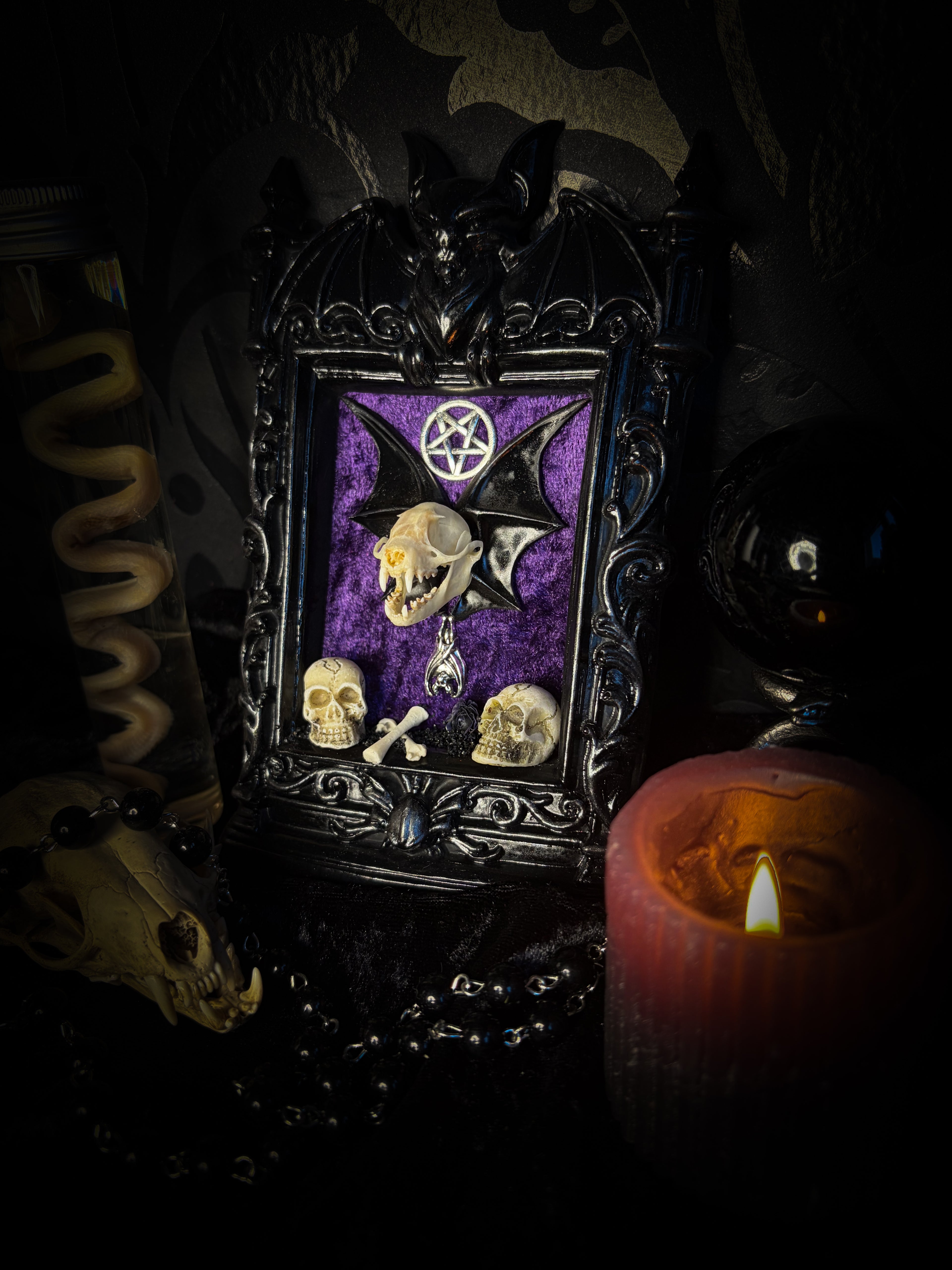 Violet Hex — handmade gothic wall relic, ready to ship. Real bat skull with hand-cast wings on violet crushed velvet in black and gold frame with sculpted bat, ornamental skulls, wax rose and pentagram details. One-of-a-kind dark decor, 16x11cm.