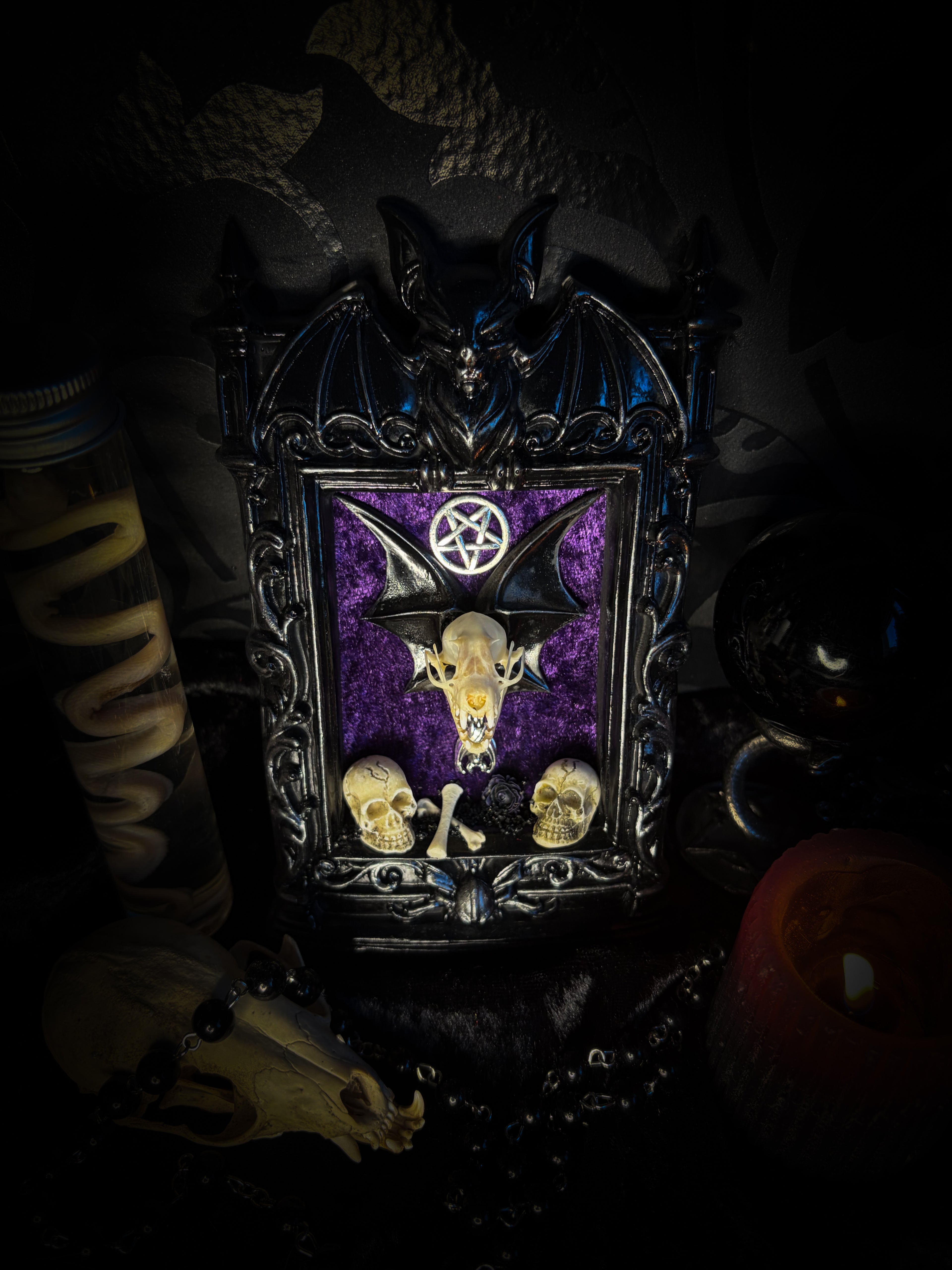 Violet Hex — handmade gothic wall relic, ready to ship. Real bat skull with hand-cast wings on violet crushed velvet in black and gold frame with sculpted bat, ornamental skulls, wax rose and pentagram details. One-of-a-kind dark decor, 16x11cm.