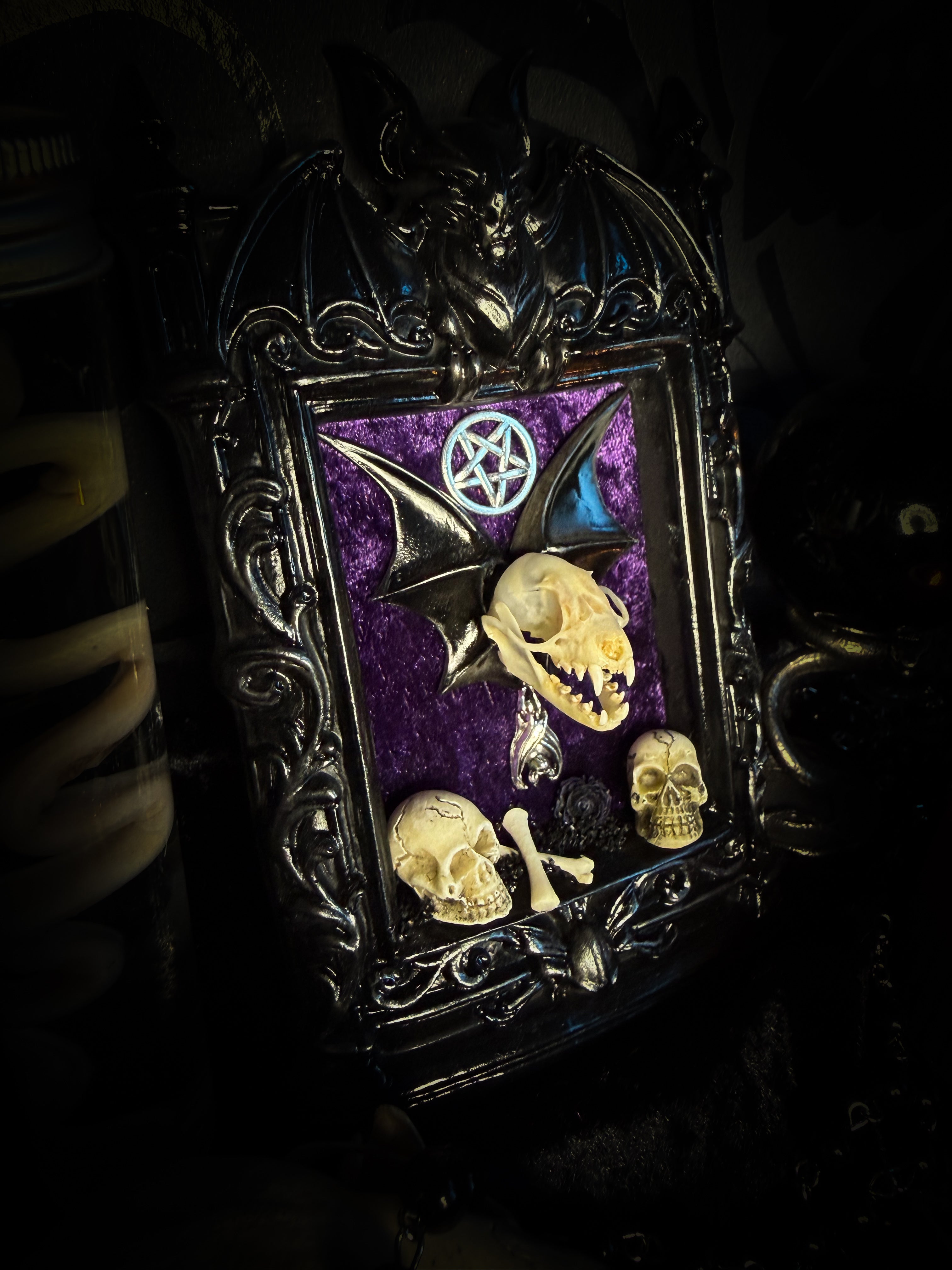 Violet Hex — handmade gothic wall relic, ready to ship. Real bat skull with hand-cast wings on violet crushed velvet in black and gold frame with sculpted bat, ornamental skulls, wax rose and pentagram details. One-of-a-kind dark decor, 16x11cm.