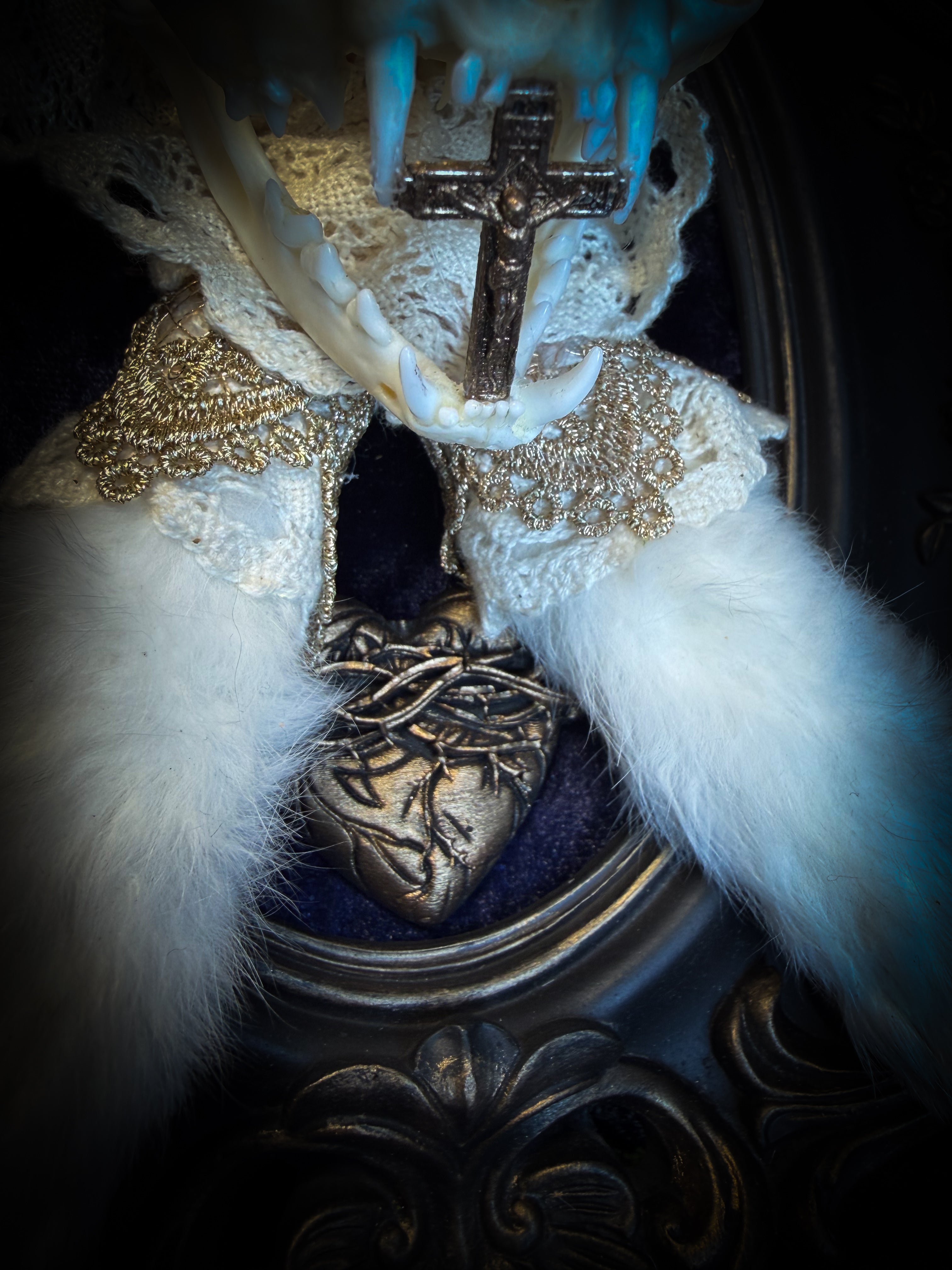 Christ Superstar | handmade Bunny Kitten puppet frame with real cat skull, albino rabbit ears and feet, golden Sacred Heart with thorns, white and gold lace, cross, white quartz moon, raven and deep navy gathered velvet in hand-cast painted baroque frame | Morbid Oddities
