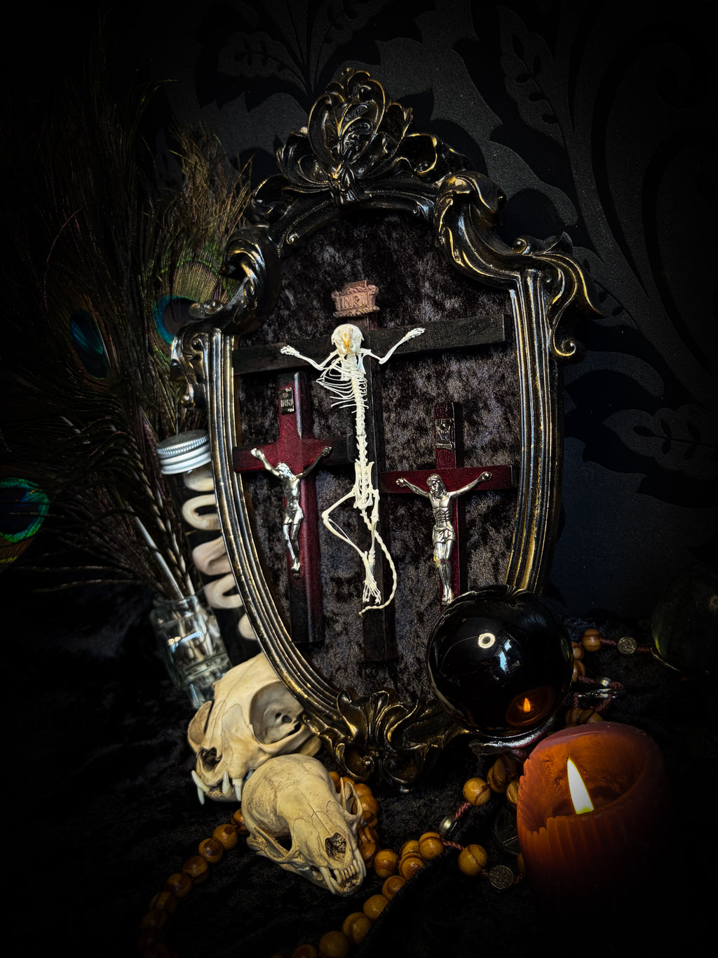 Golgotha | handmade occult relic with real mouse skeleton on three crosses with INRI inscription, cast and painted black and gold frame, black velvet backing | Morbid Oddities

