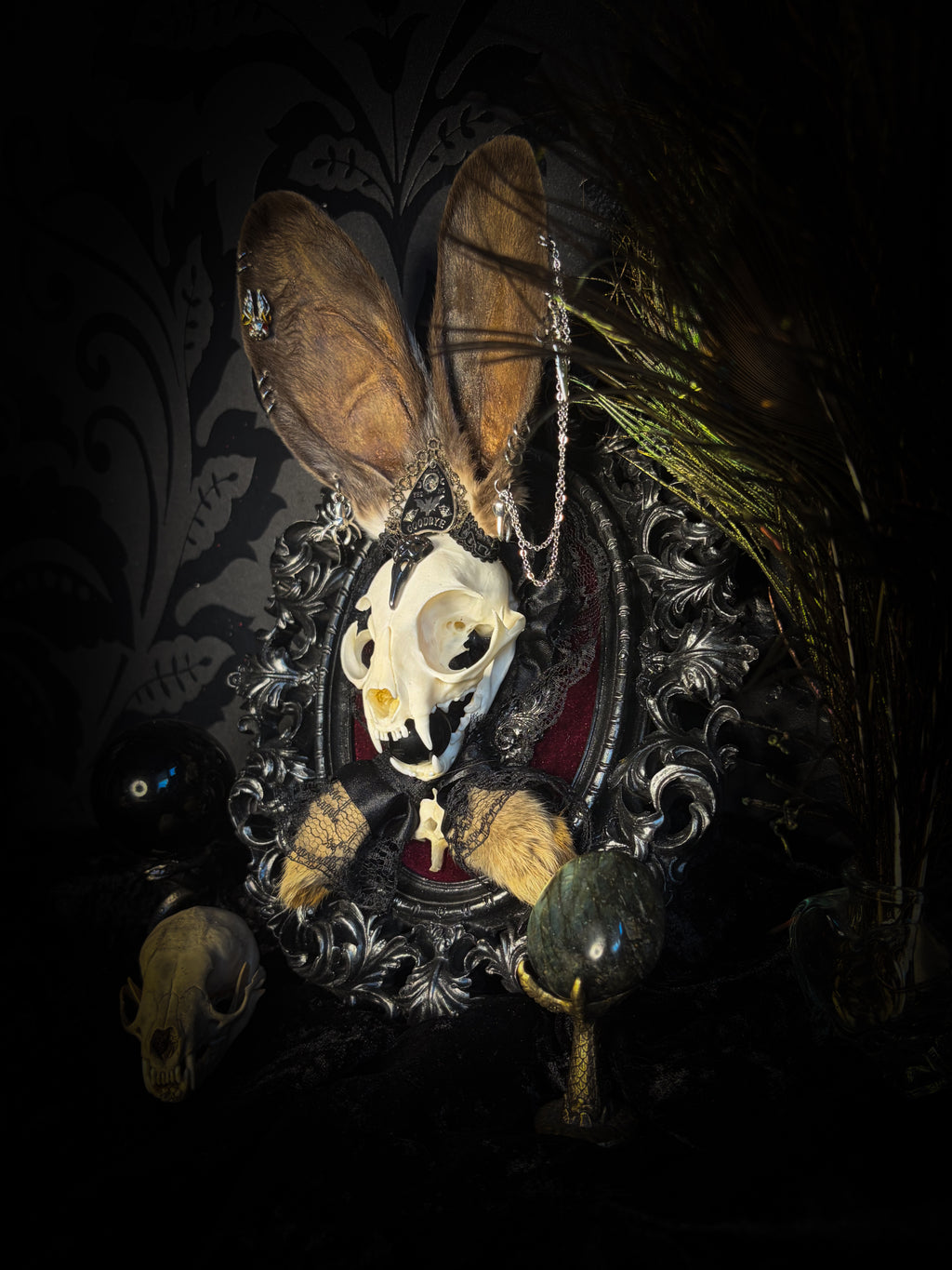Vampiria whimsical shadowbox — cat skull with rabbit fur ears, red velvet, black lace, ouija planchette and ornate silver-black frame
