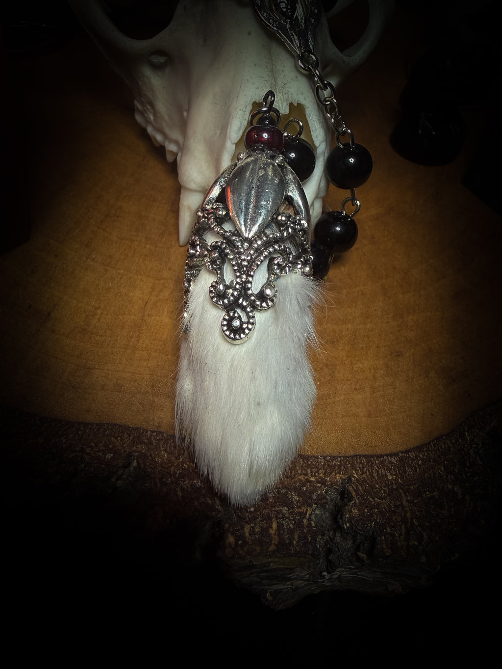 Rabbit Foot Rosary | Necklaces — handmade dark necklace with real preserved white rabbit foot, partial rosary chain, carnelian beads and ornamental metal detail, macabre alternative jewellery