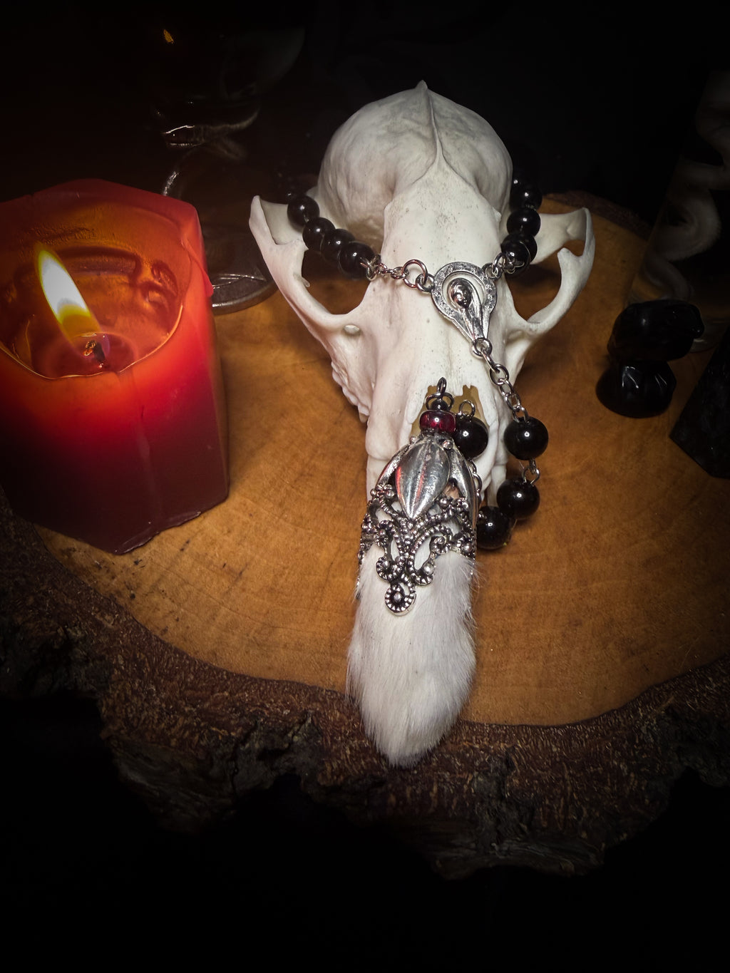 Rabbit Foot Rosary | Necklaces — handmade dark necklace with real preserved white rabbit foot, partial rosary chain, carnelian beads and ornamental metal detail, macabre alternative jewellery