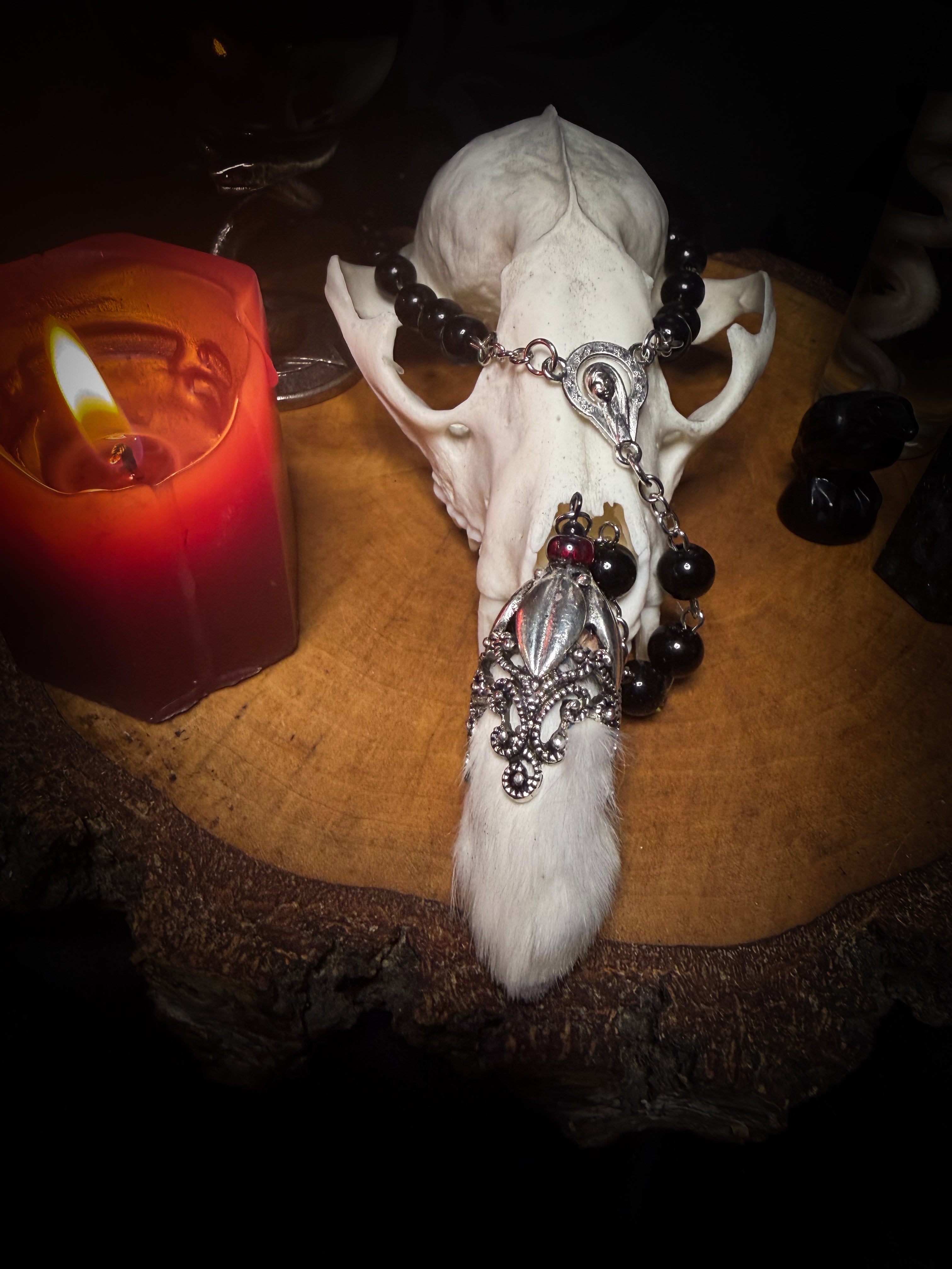 Rabbit Foot Rosary | Necklaces — handmade dark necklace with real preserved white rabbit foot, partial rosary chain, carnelian beads and ornamental metal detail, macabre alternative jewellery