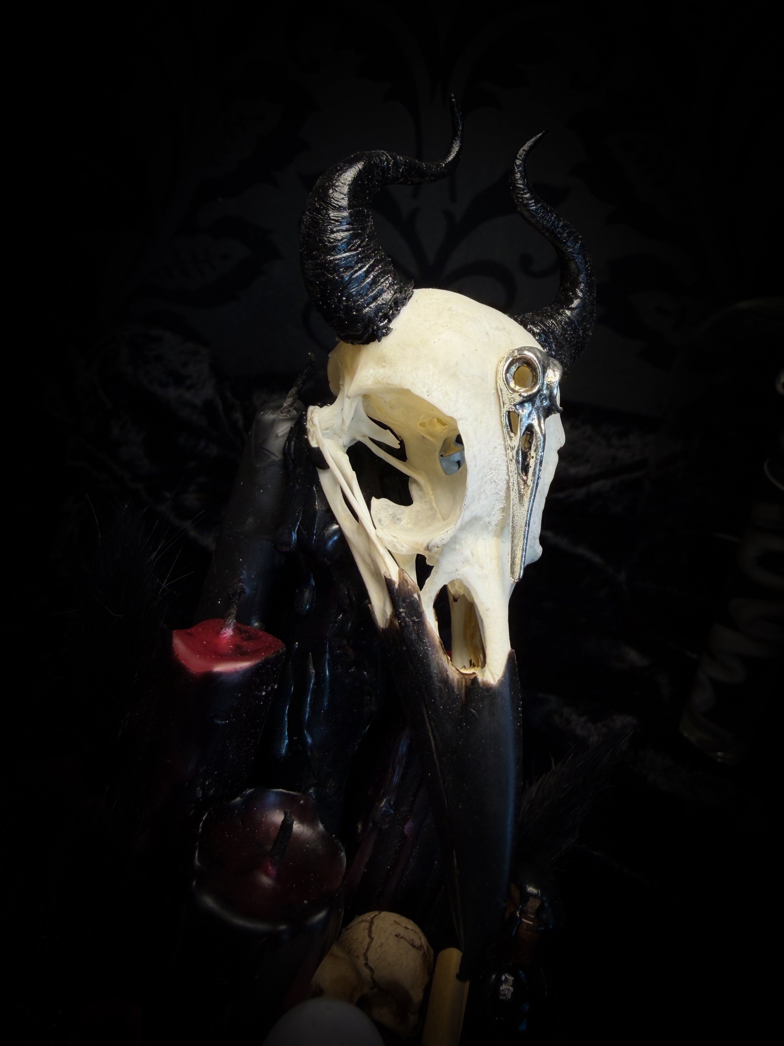 Nox Solitudinis — handmade gothic display with crow skull, hand-carved horns, crystal orb, vampire candles, wax rose and black iridescent sand. Morbid Oddities.