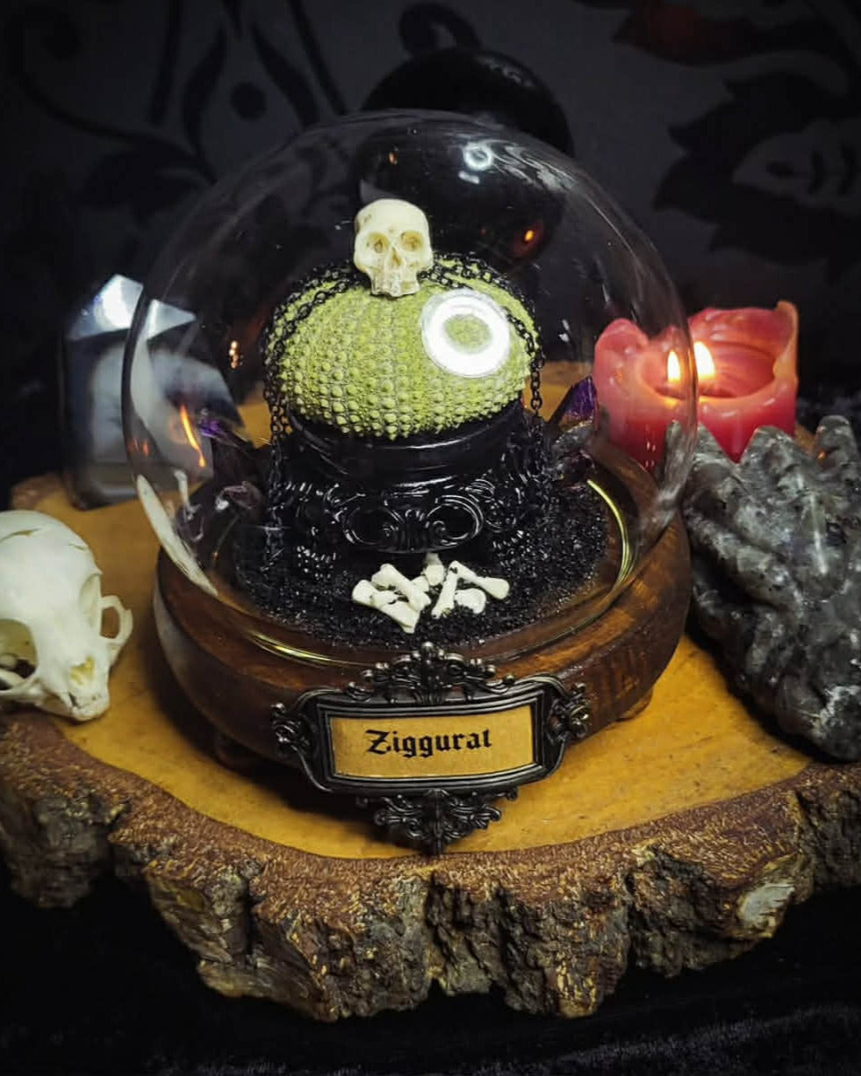 Siggurat | Occult — handmade gothic altar piece with ziggurat-inspired centerpiece, real bone elements, sea urchin skeleton, decorative crystals and chains under glass dome on hand-painted wooden base, 10x10cm