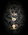 Handmade gothic necklace — real mouse skull in circular resin pendant, dried red petals, triple moon pentagram charm, garnet beads