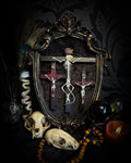 Golgotha | handmade occult relic with real mouse skeleton on three crosses with INRI inscription, cast and painted black and gold frame, black velvet backing | Morbid Oddities
